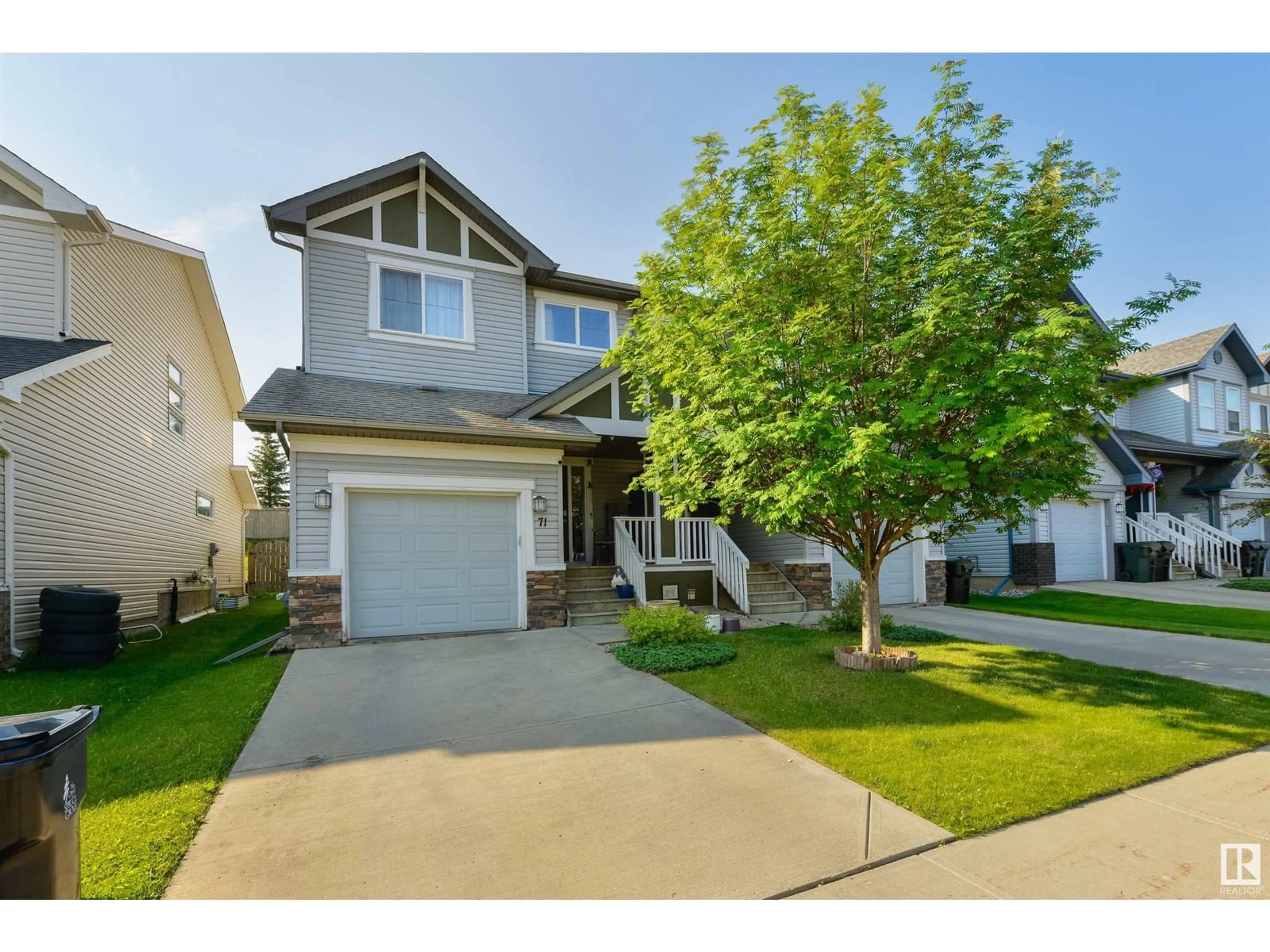 Home with vinyl exterior material, street for 71 HARTWICK LO, Spruce Grove Alberta T7X0A5