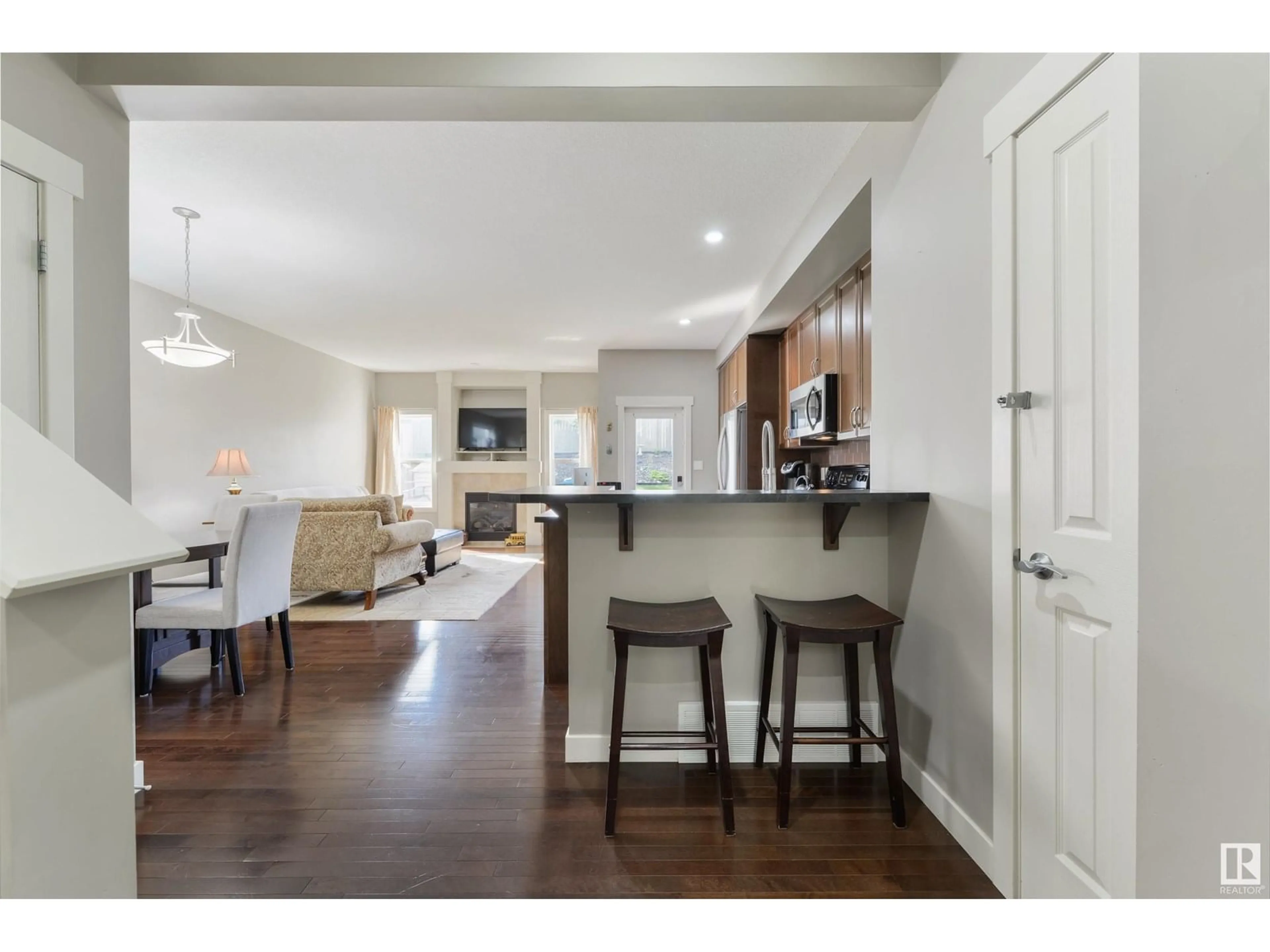 Open concept kitchen, wood/laminate floor for 71 HARTWICK LO, Spruce Grove Alberta T7X0A5