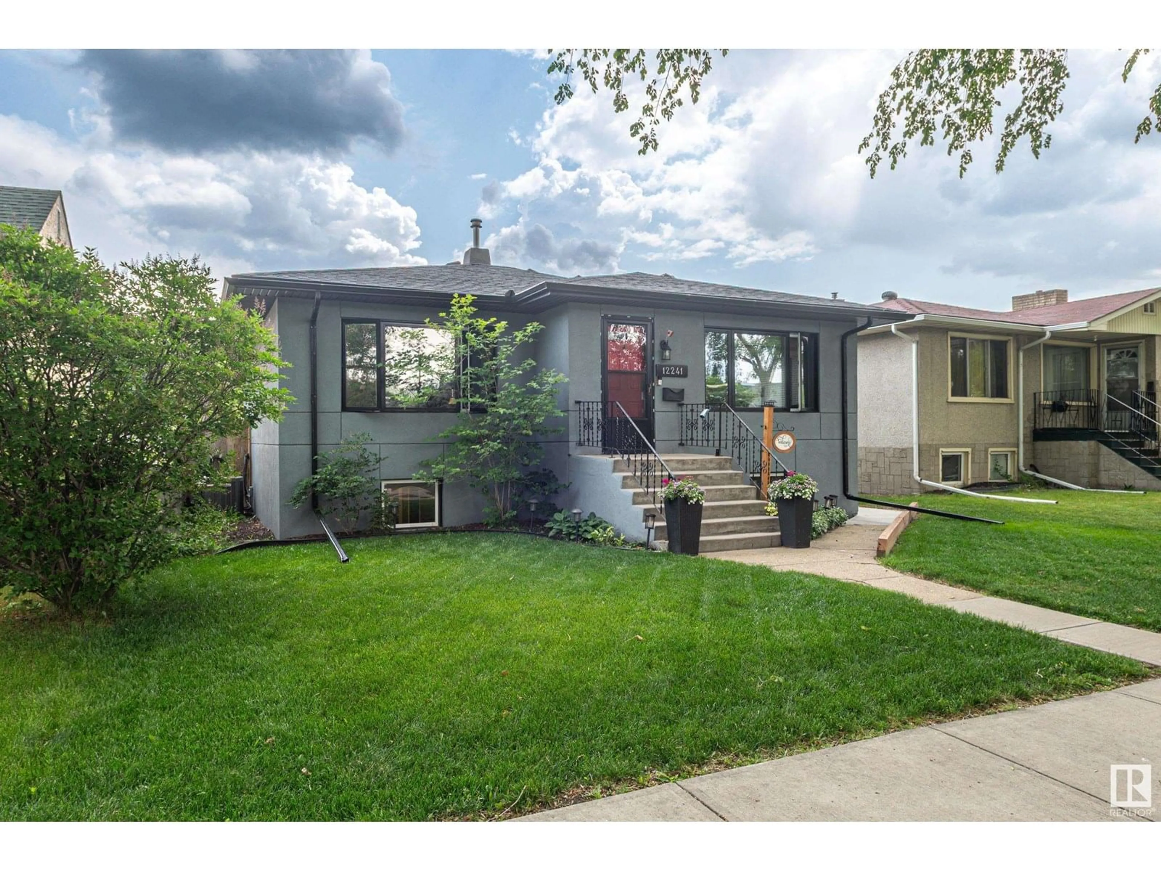 Home with vinyl exterior material, street for 12241 95A ST, Edmonton Alberta T5G1S2