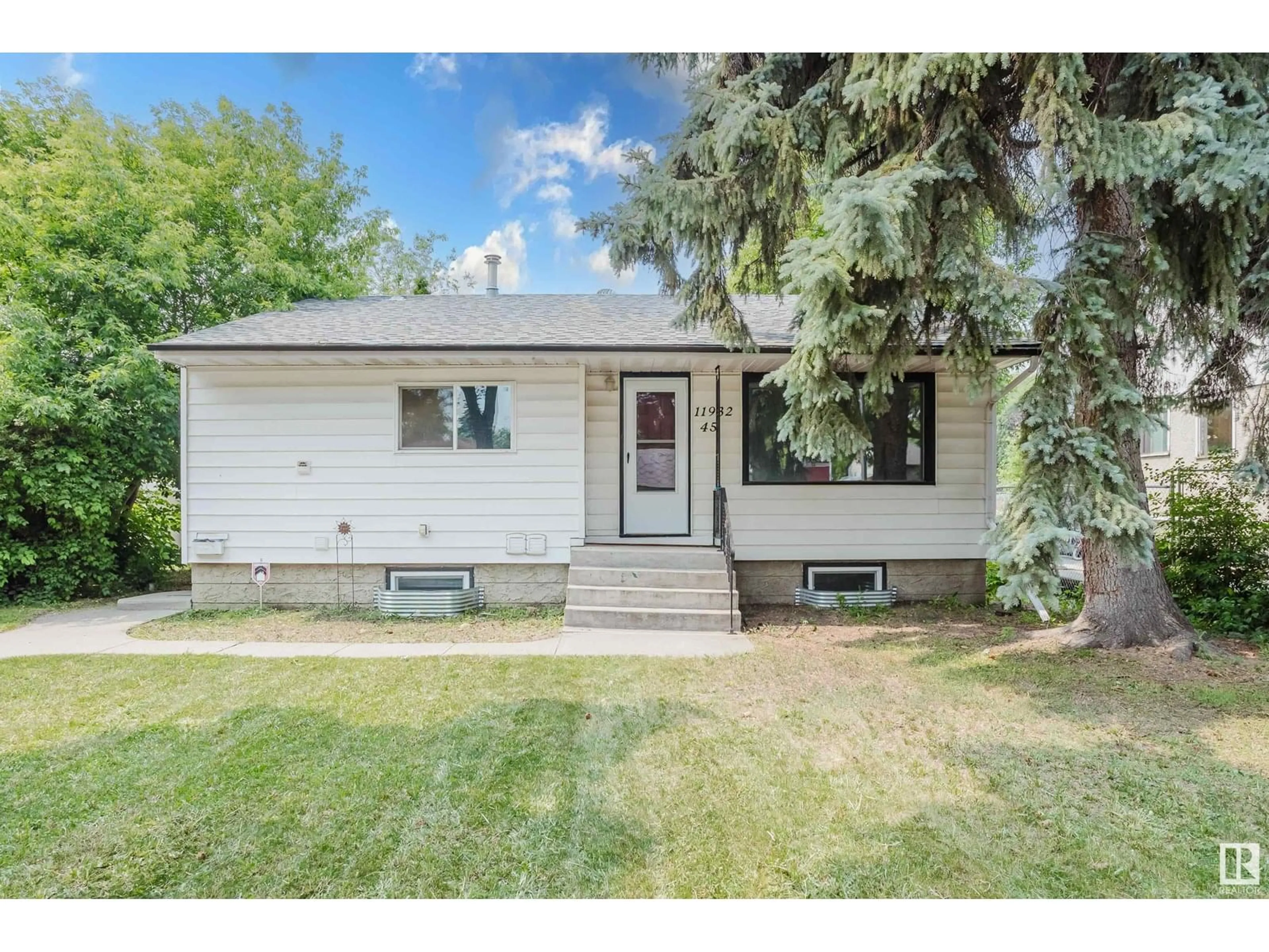 Home with vinyl exterior material, street for NW - 11932 45 ST, Edmonton Alberta T5W2T6