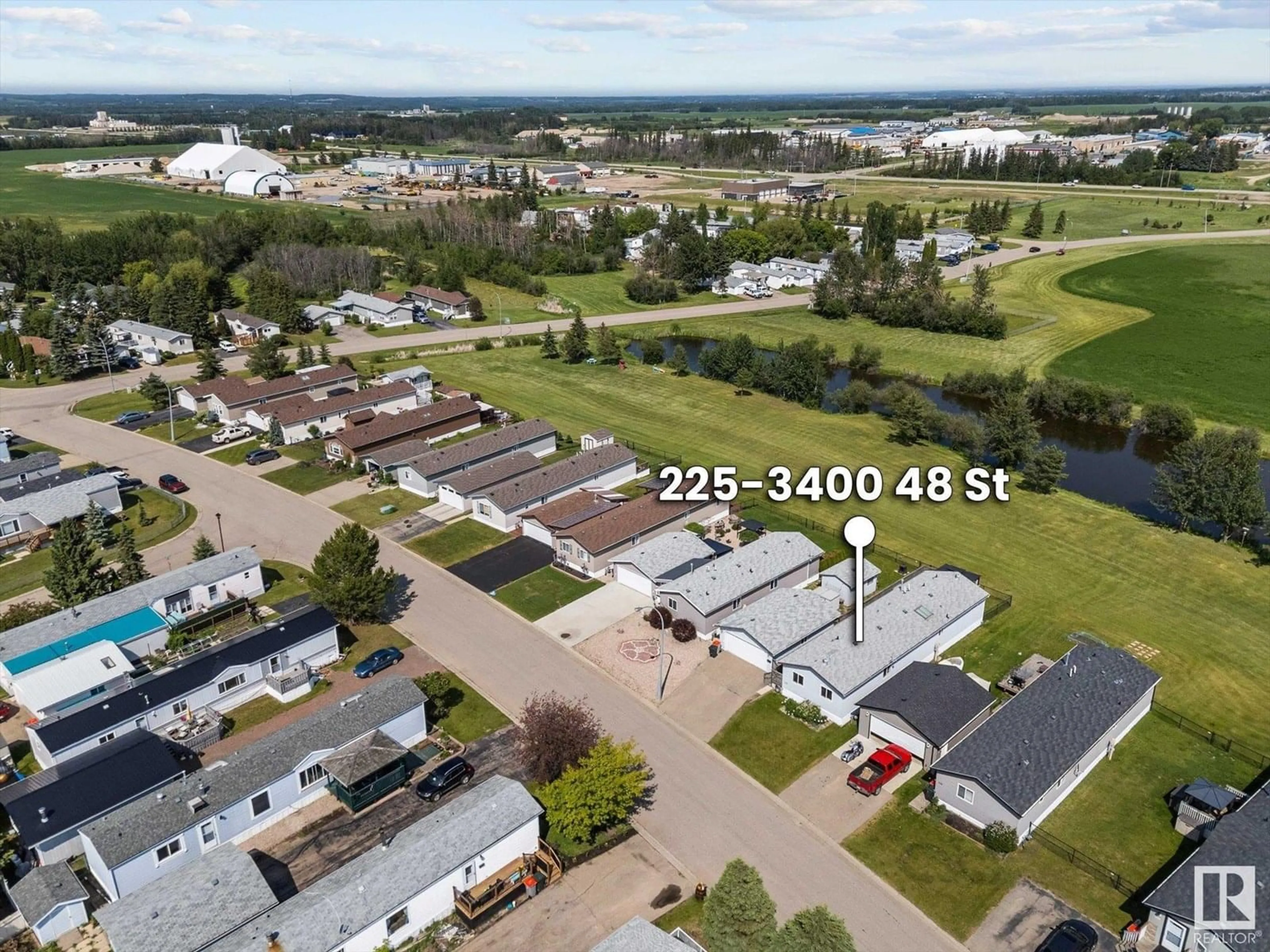 A pic from outside/outdoor area/front of a property/back of a property/a pic from drone, street for 225 3400 48 ST, Stony Plain Alberta T7Z1W2