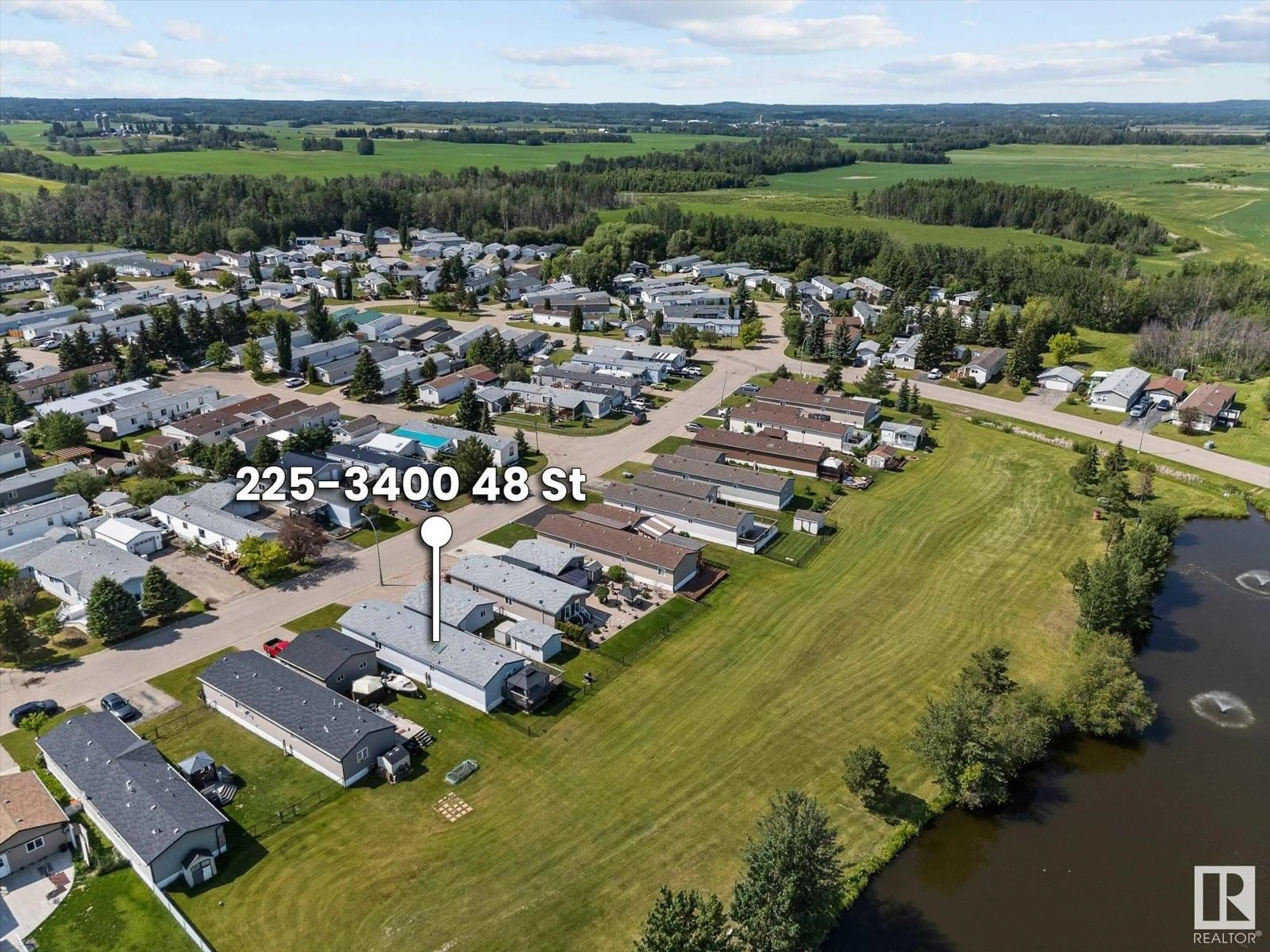 A pic from outside/outdoor area/front of a property/back of a property/a pic from drone, water/lake/river/ocean view for 225 3400 48 ST, Stony Plain Alberta T7Z1W2