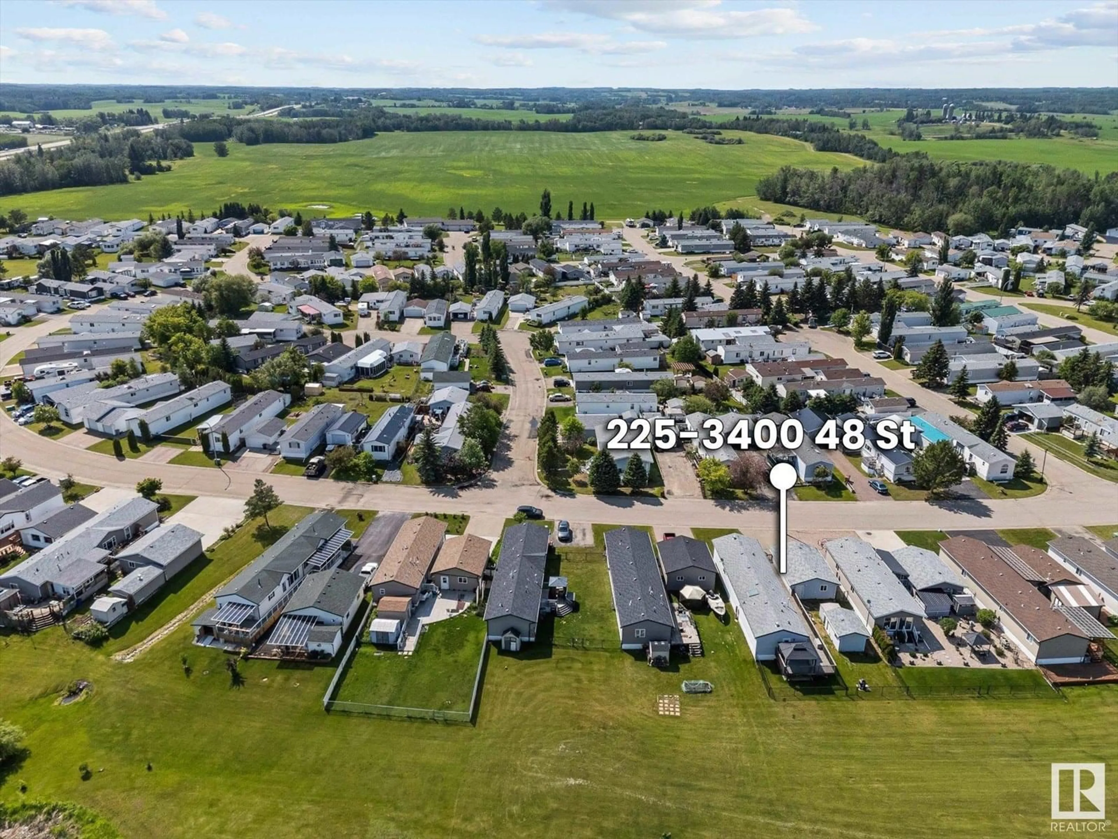 A pic from outside/outdoor area/front of a property/back of a property/a pic from drone, street for 225 3400 48 ST, Stony Plain Alberta T7Z1W2