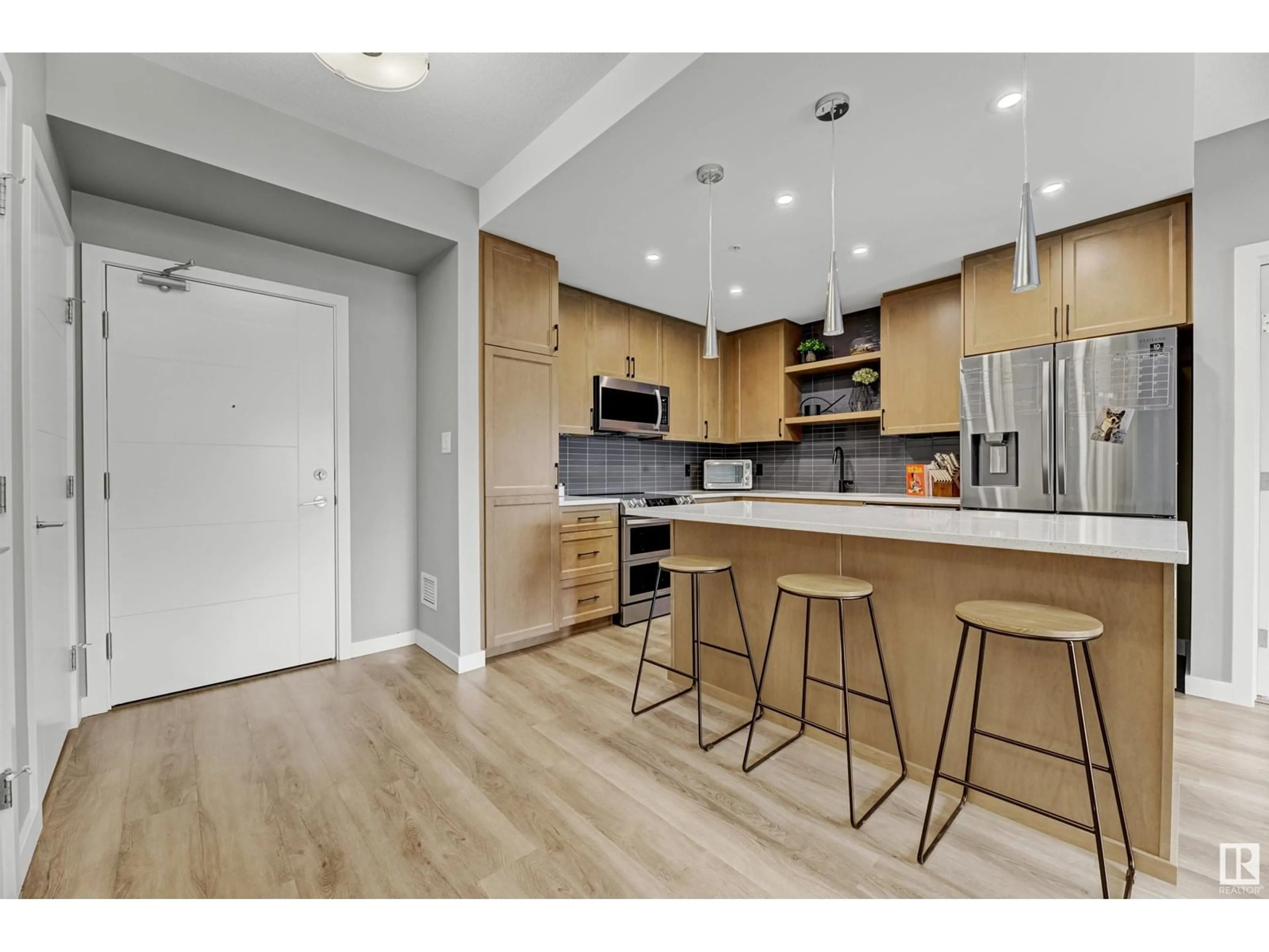 Open concept kitchen, wood/laminate floor for 1154 - 226 ADAMSON DR, Edmonton Alberta T6W3N5