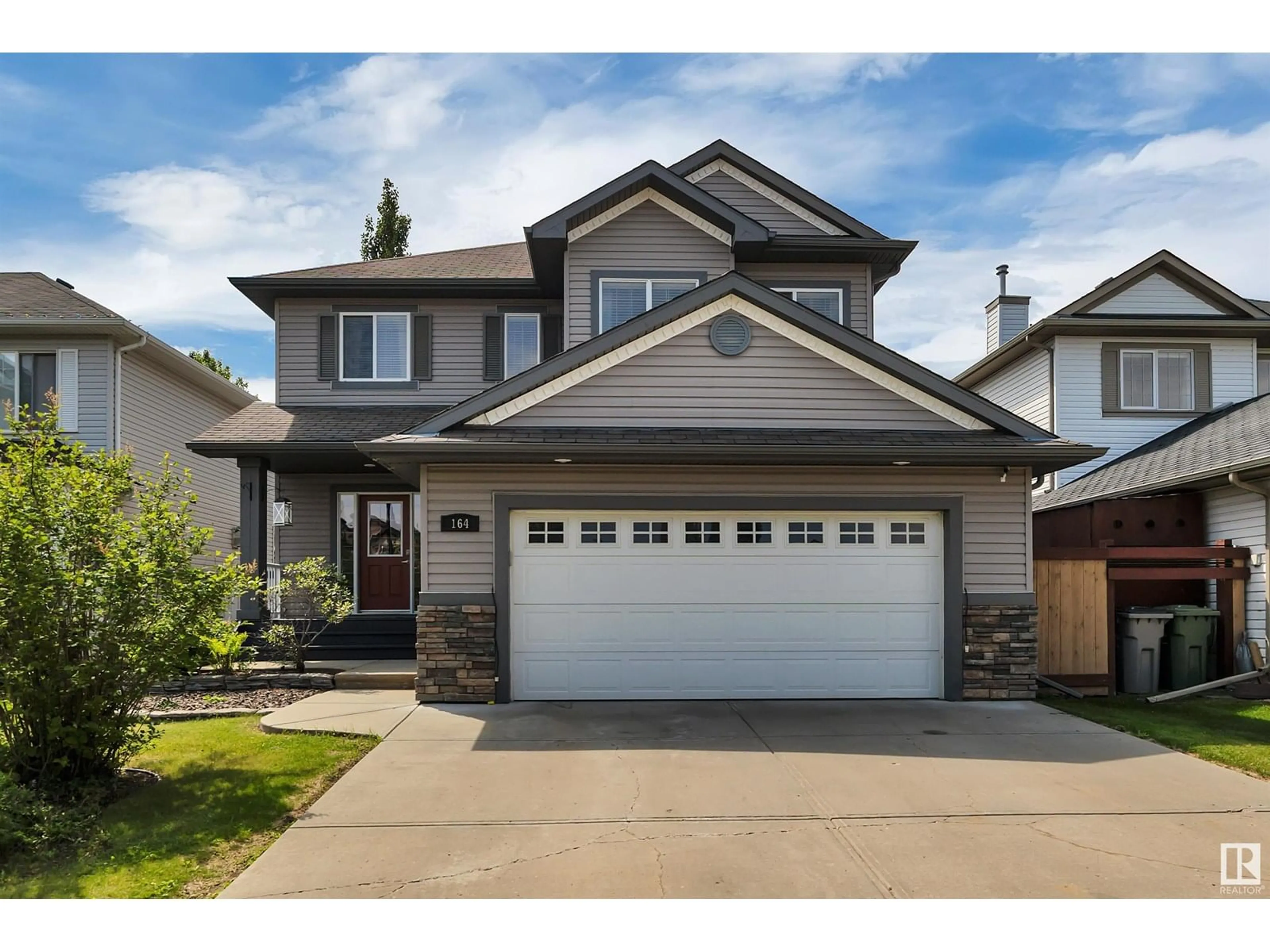 Home with vinyl exterior material, street for 164 RUE MASSON, Beaumont Alberta T4X1W2
