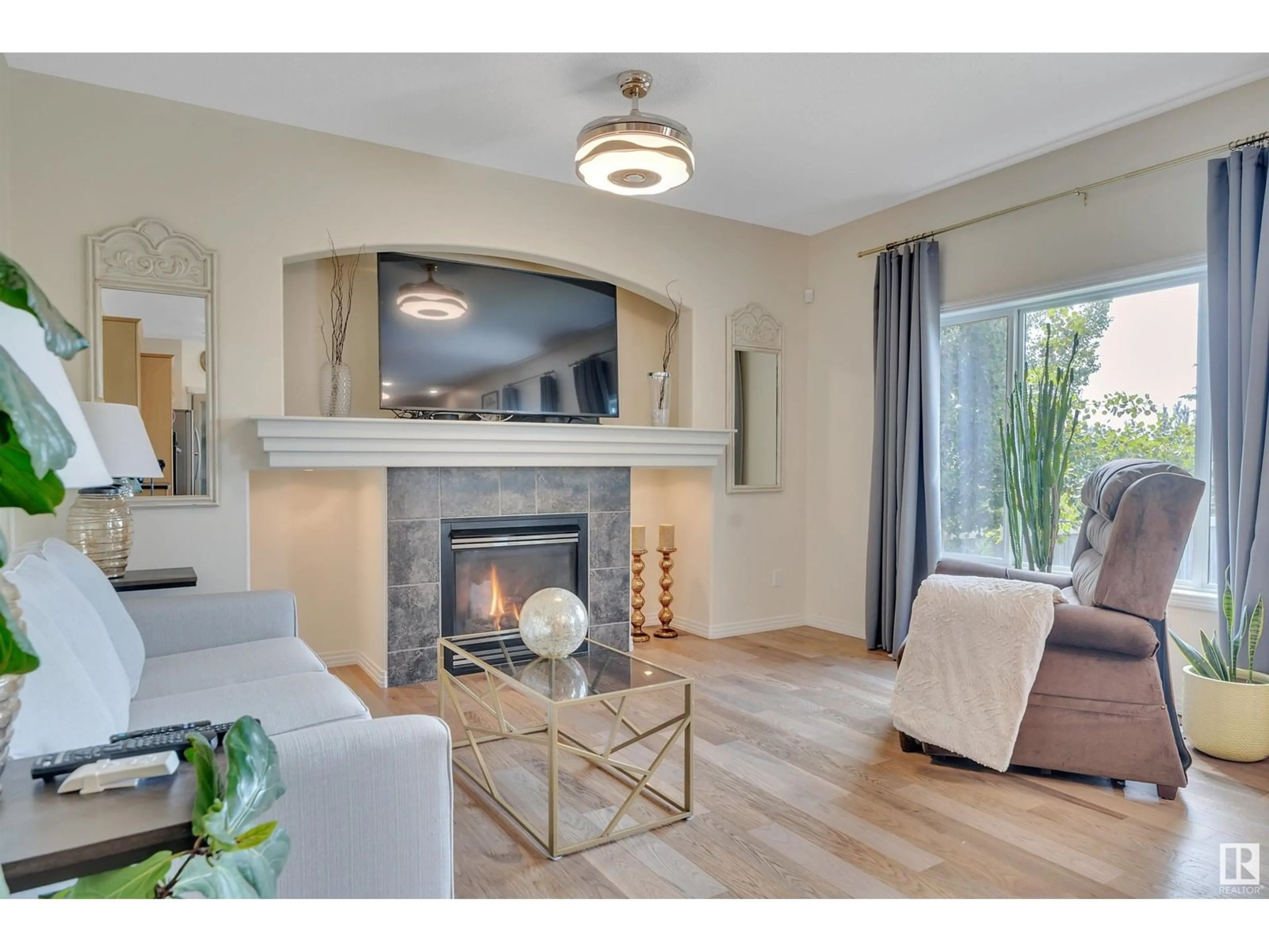 Living room with furniture, wood/laminate floor for 164 RUE MASSON, Beaumont Alberta T4X1W2