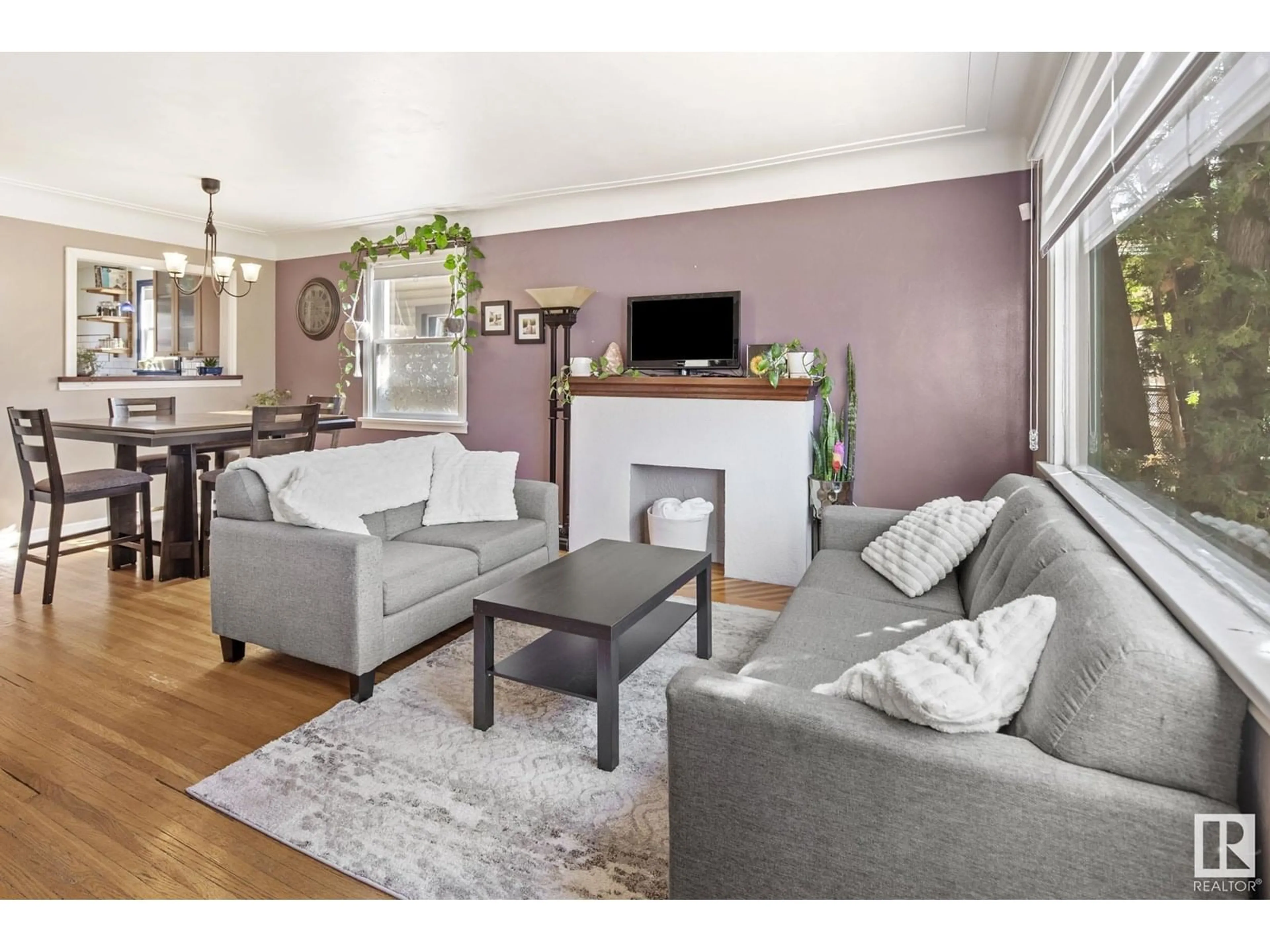Living room with furniture, wood/laminate floor for NW - 11429 65 ST, Edmonton Alberta T5W4K7