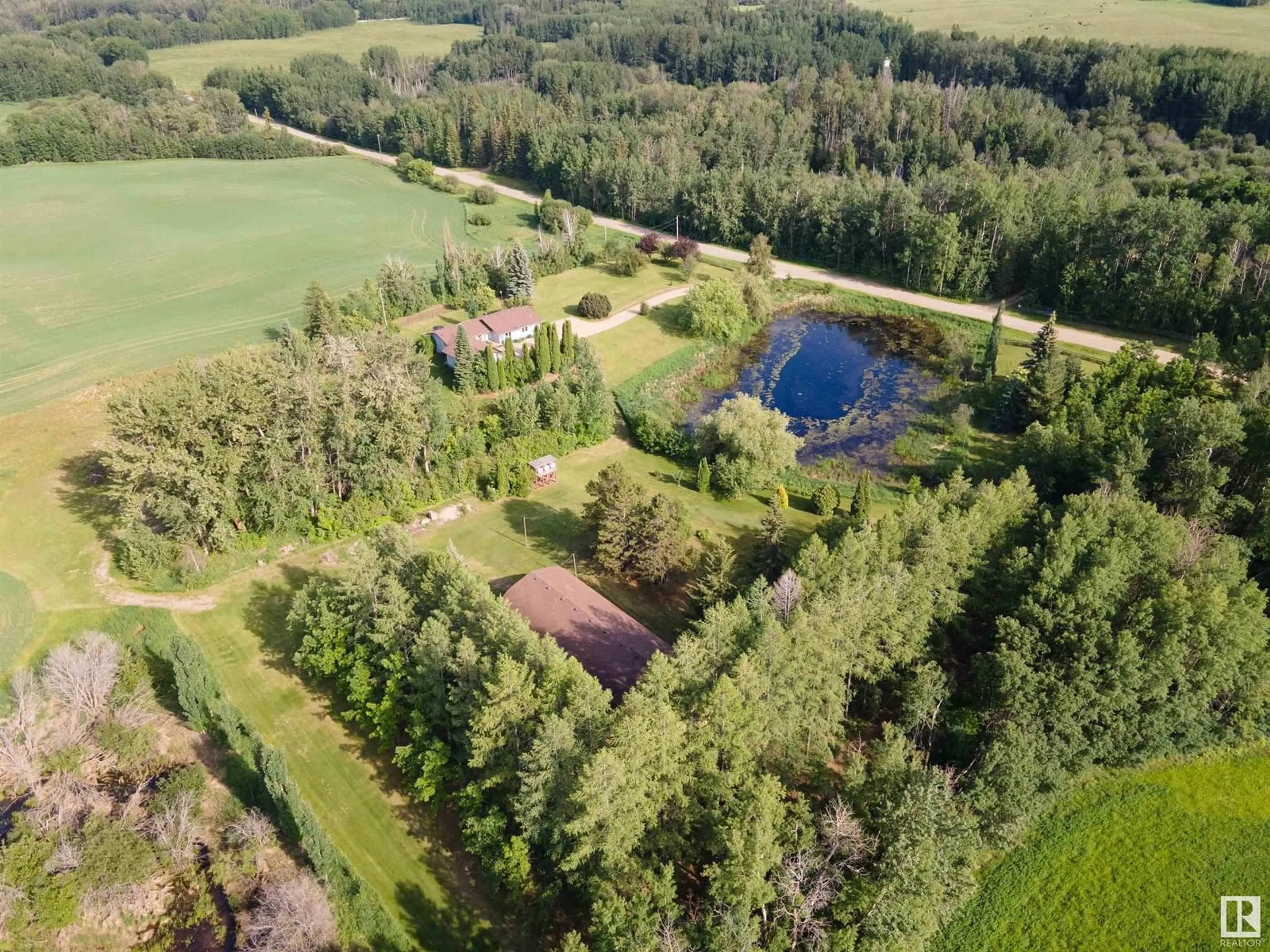 A pic from outside/outdoor area/front of a property/back of a property/a pic from drone, forest/trees view for 1514 TWP ROAD 514, Rural Parkland County Alberta T7Y3J2
