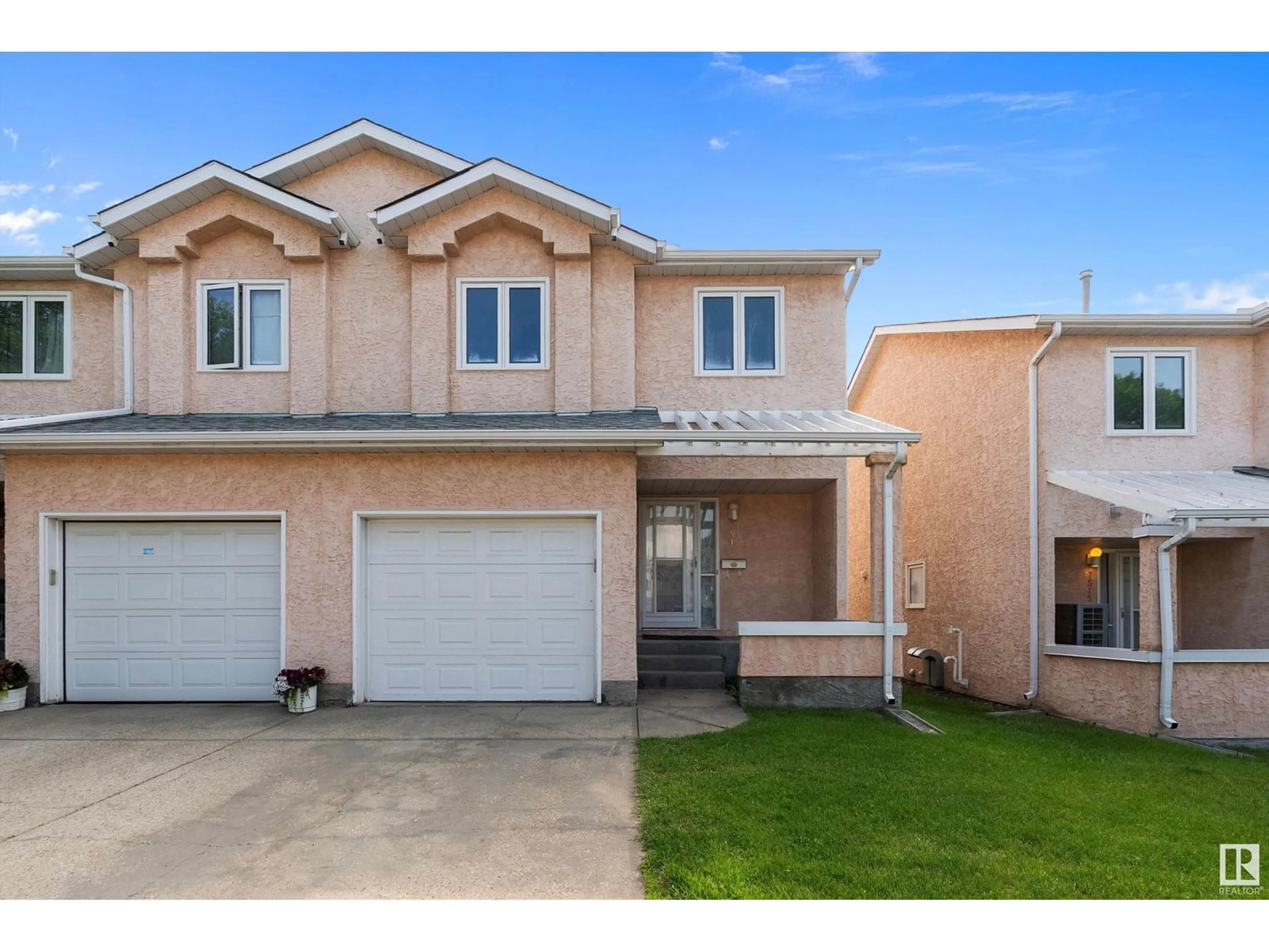 Home with vinyl exterior material, street for 7517 188 ST, Edmonton Alberta T5T5W9