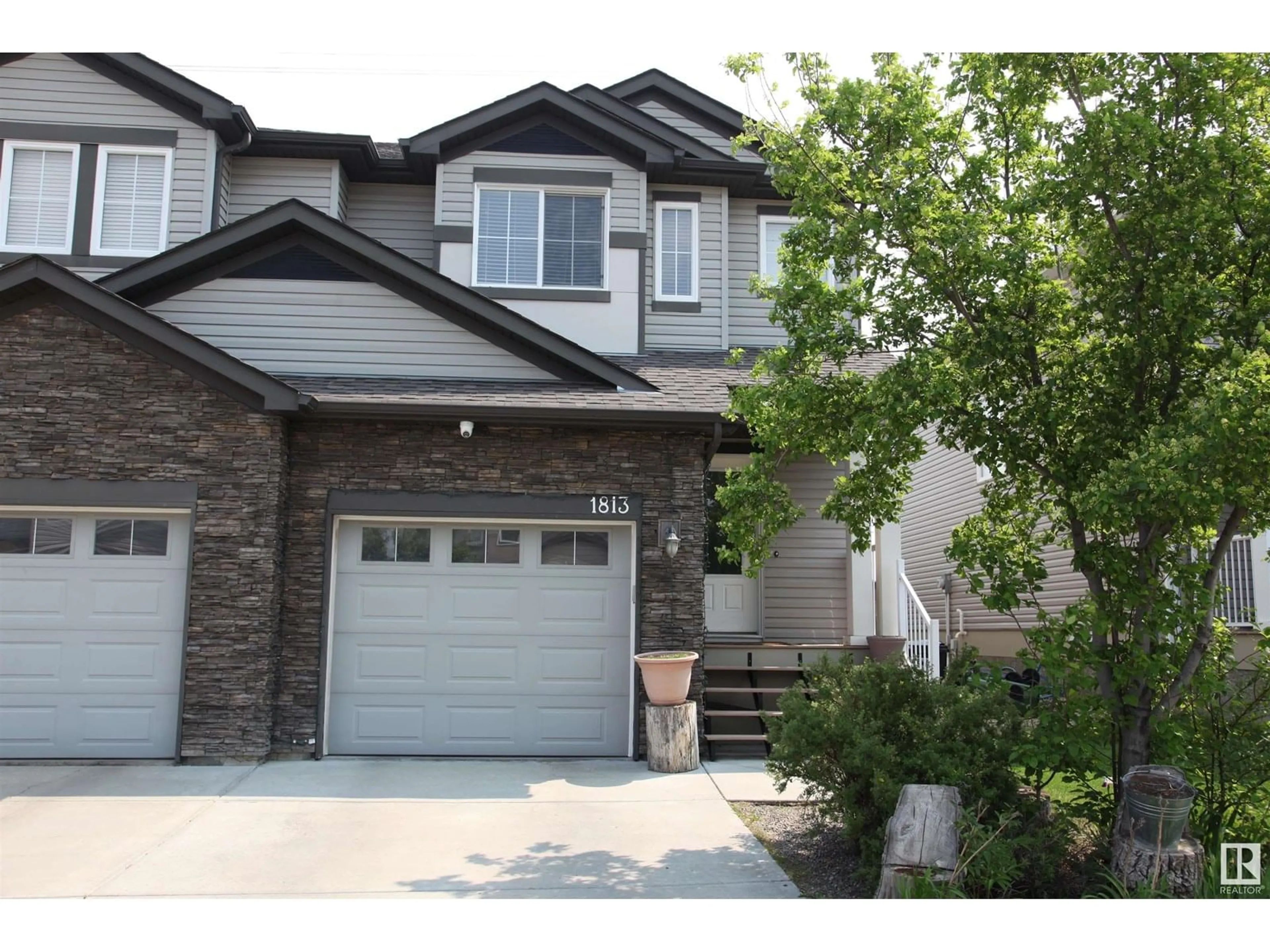 Home with vinyl exterior material, street for NW - 1813 28 ST, Edmonton Alberta T6T0S7