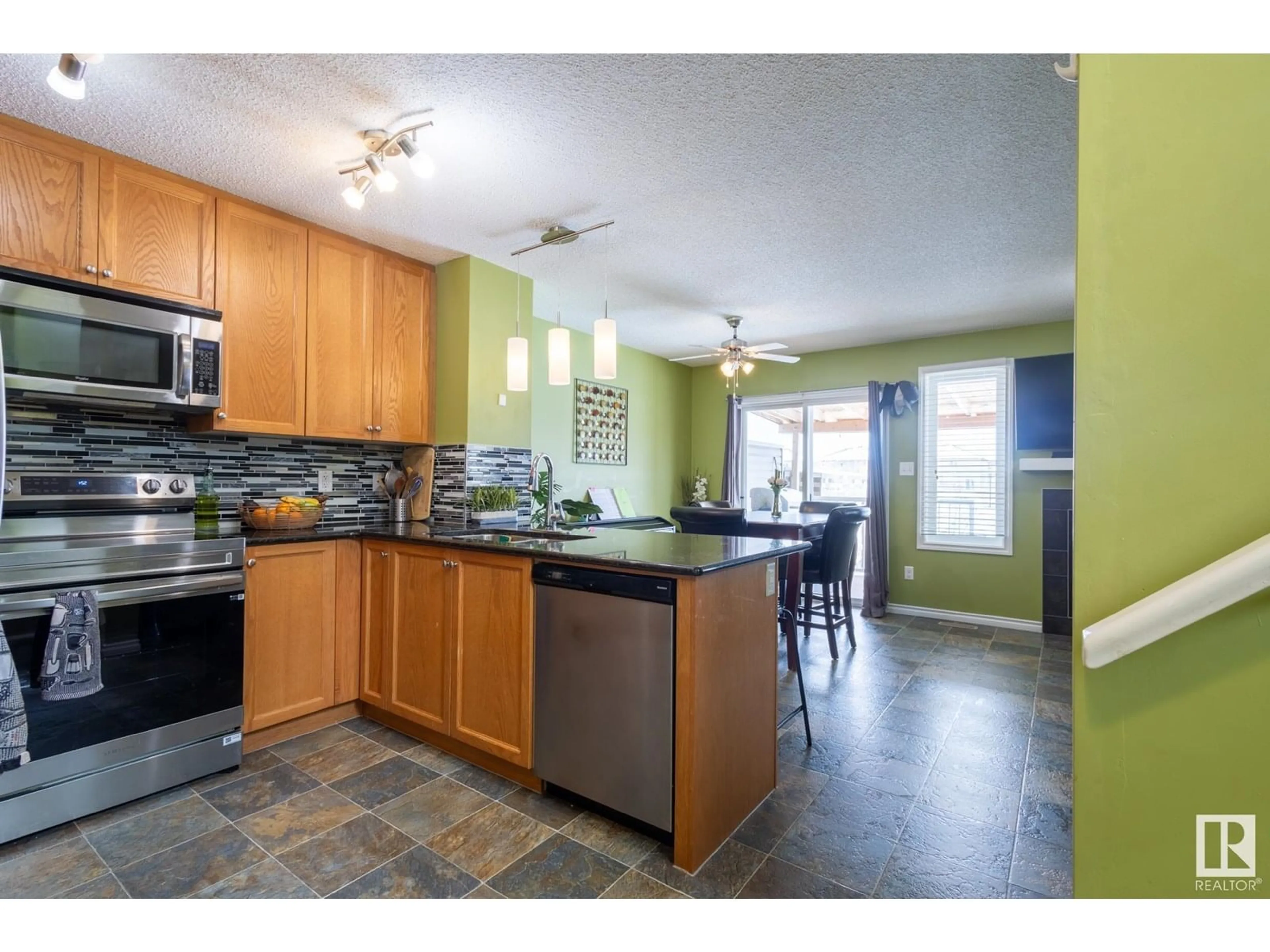 Open concept kitchen, ceramic/tile floor for NW - 1813 28 ST, Edmonton Alberta T6T0S7