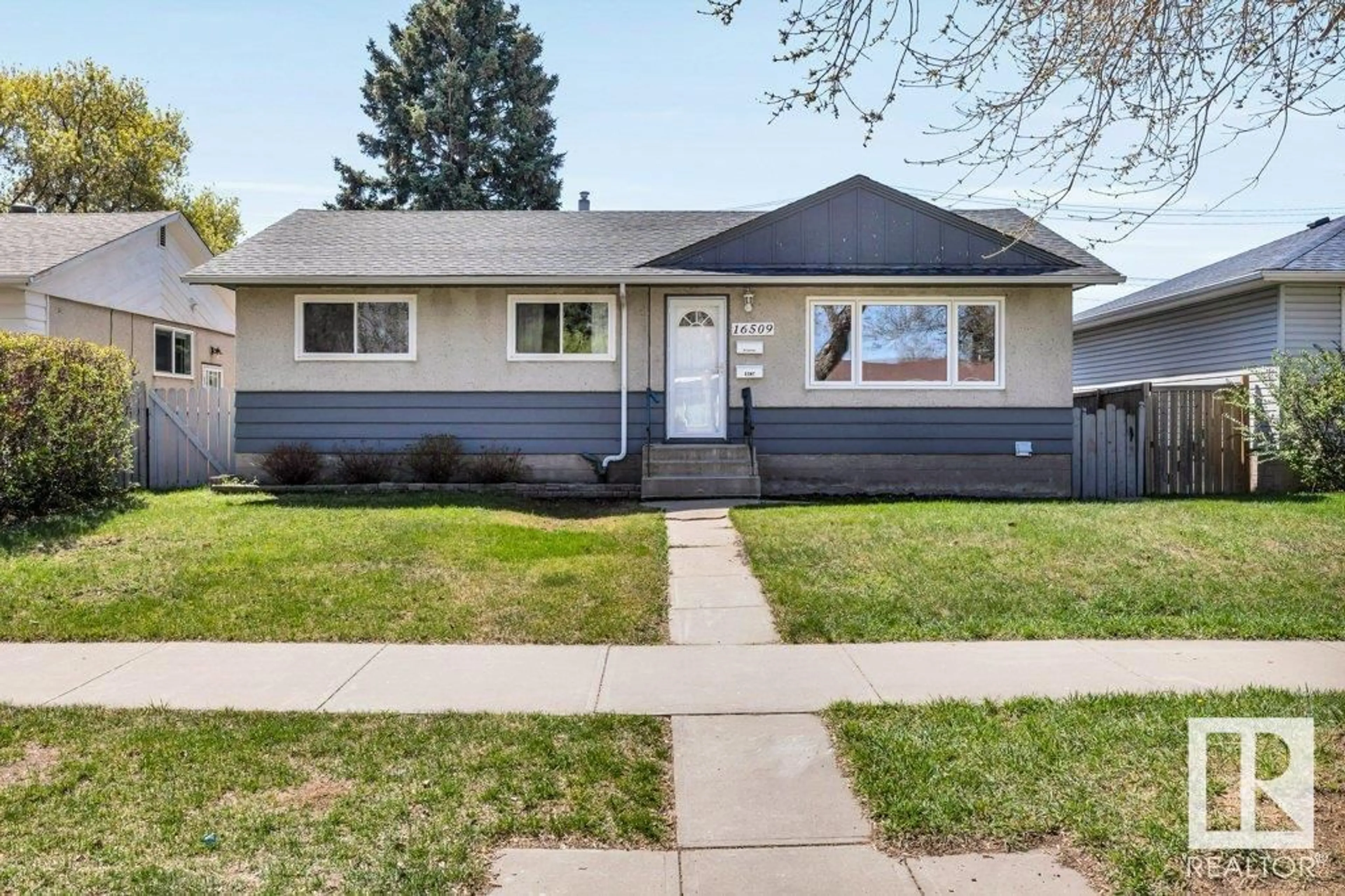 Home with vinyl exterior material, street for 16509 103 AV, Edmonton Alberta T5P0R1
