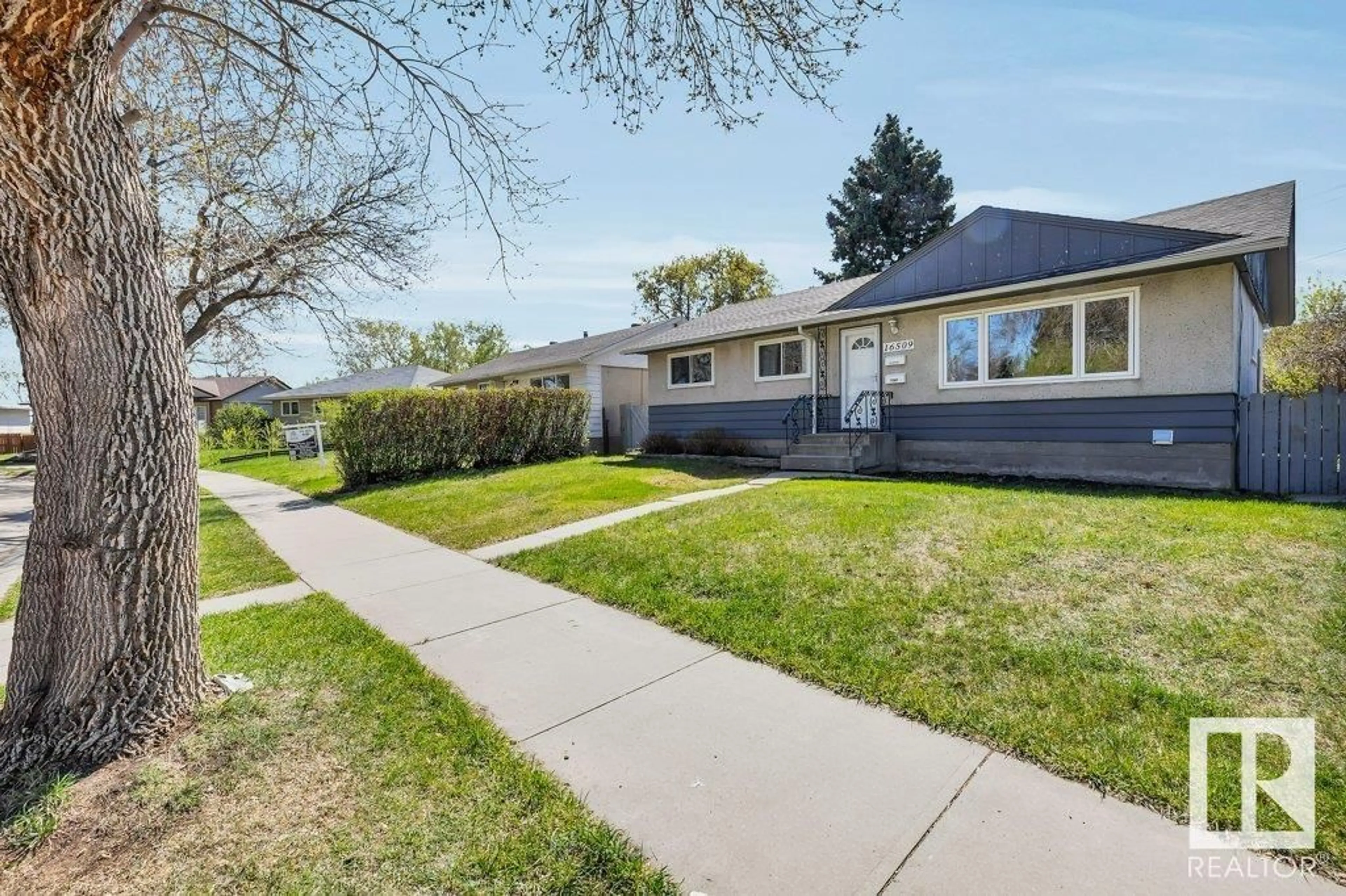 Home with vinyl exterior material, street for 16509 103 AV, Edmonton Alberta T5P0R1
