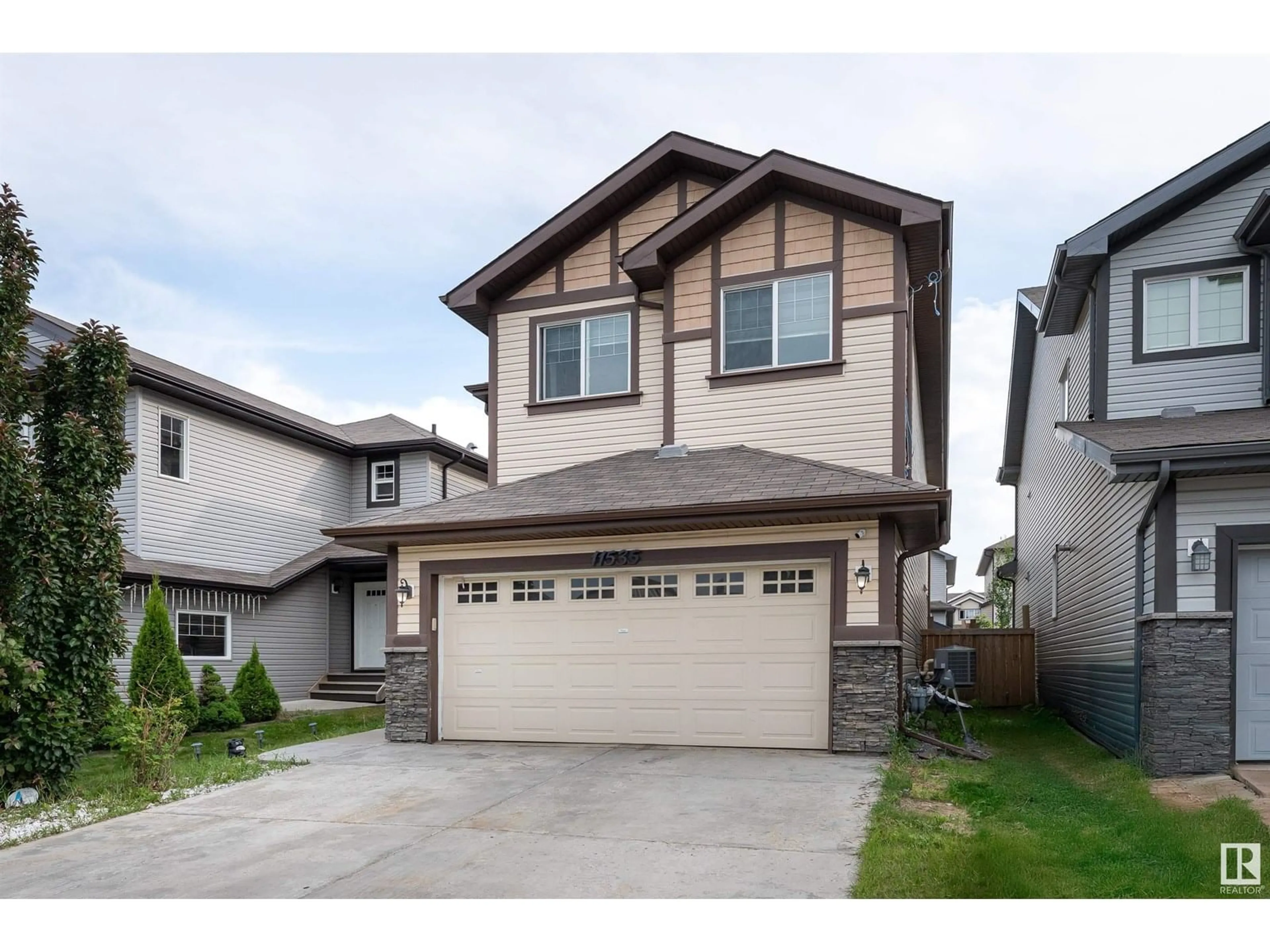 Home with vinyl exterior material, street for 11535 16 AV, Edmonton Alberta T6W0Z9