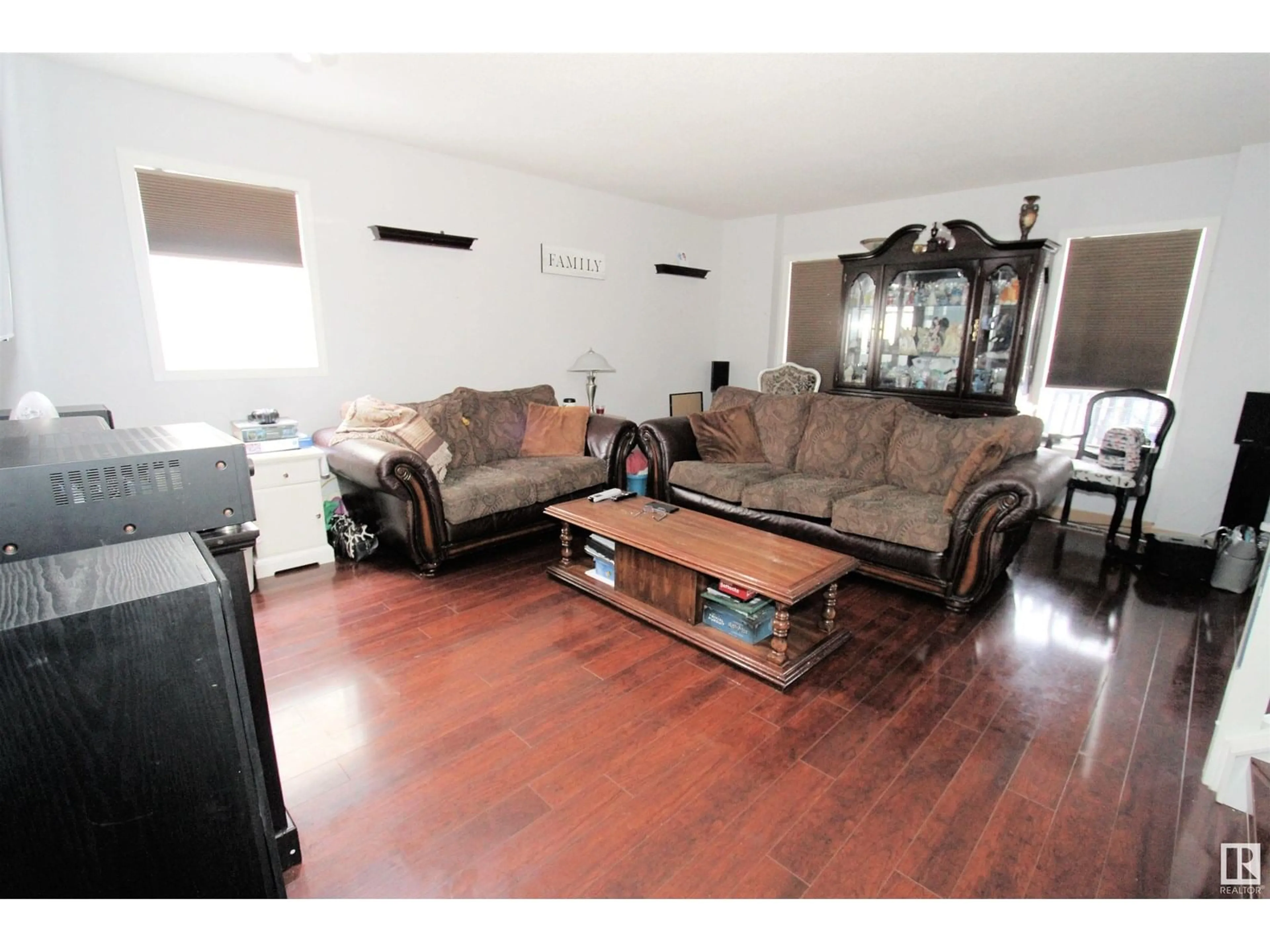 Living room with furniture, wood/laminate floor for 1873 TOWNE CENTRE BV, Edmonton Alberta T6R3J6
