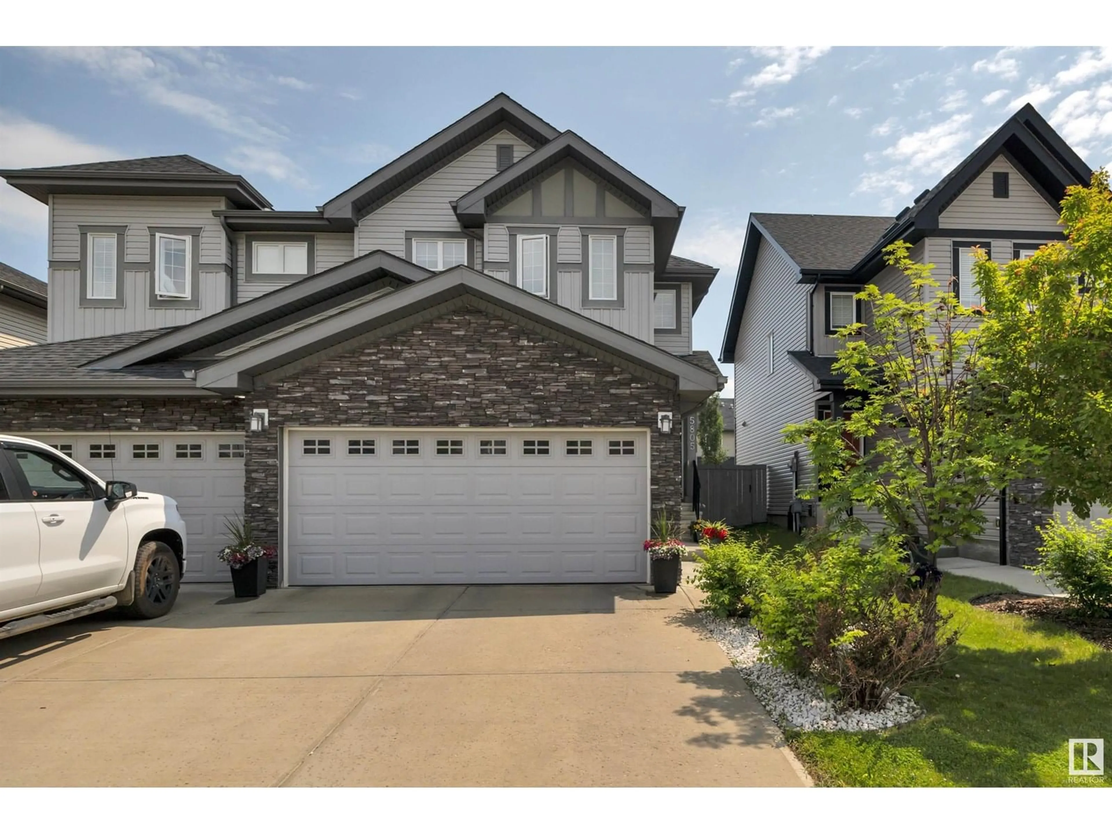 Home with vinyl exterior material, street for 5805 64 ST, Beaumont Alberta T4X1Z1