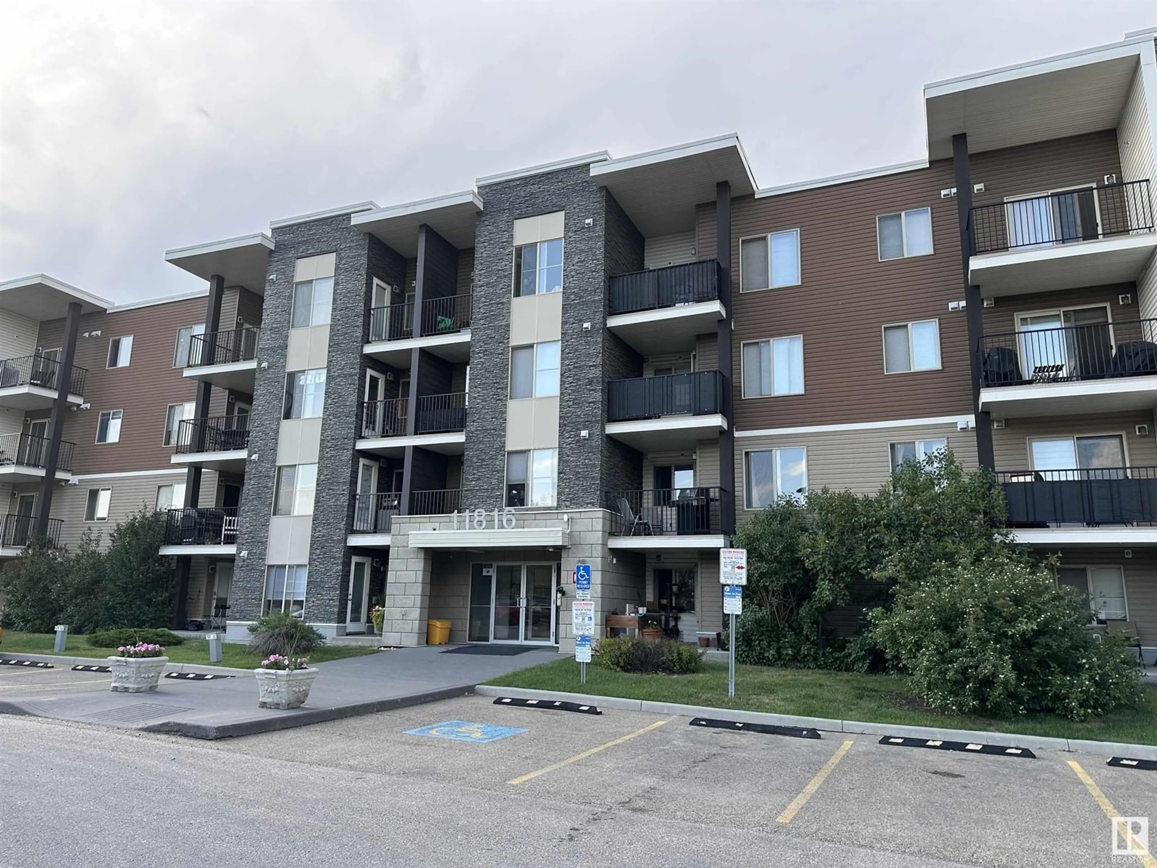 A pic from outside/outdoor area/front of a property/back of a property/a pic from drone, building for 205 11816 22 AV SW, Edmonton Alberta T6W2A2