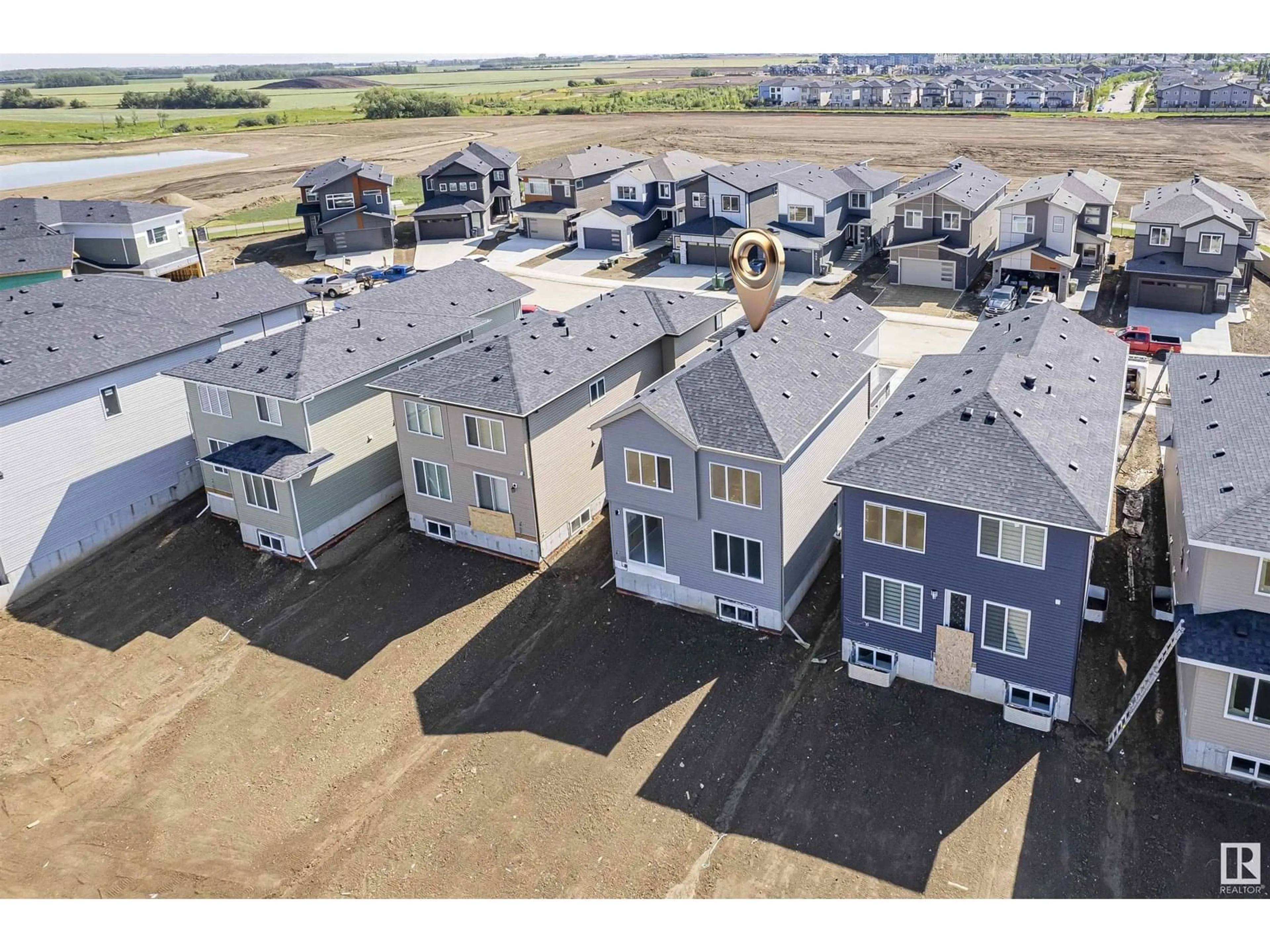 A pic from outside/outdoor area/front of a property/back of a property/a pic from drone, unknown for 407 PINE POINT, Leduc Alberta T9E1S7