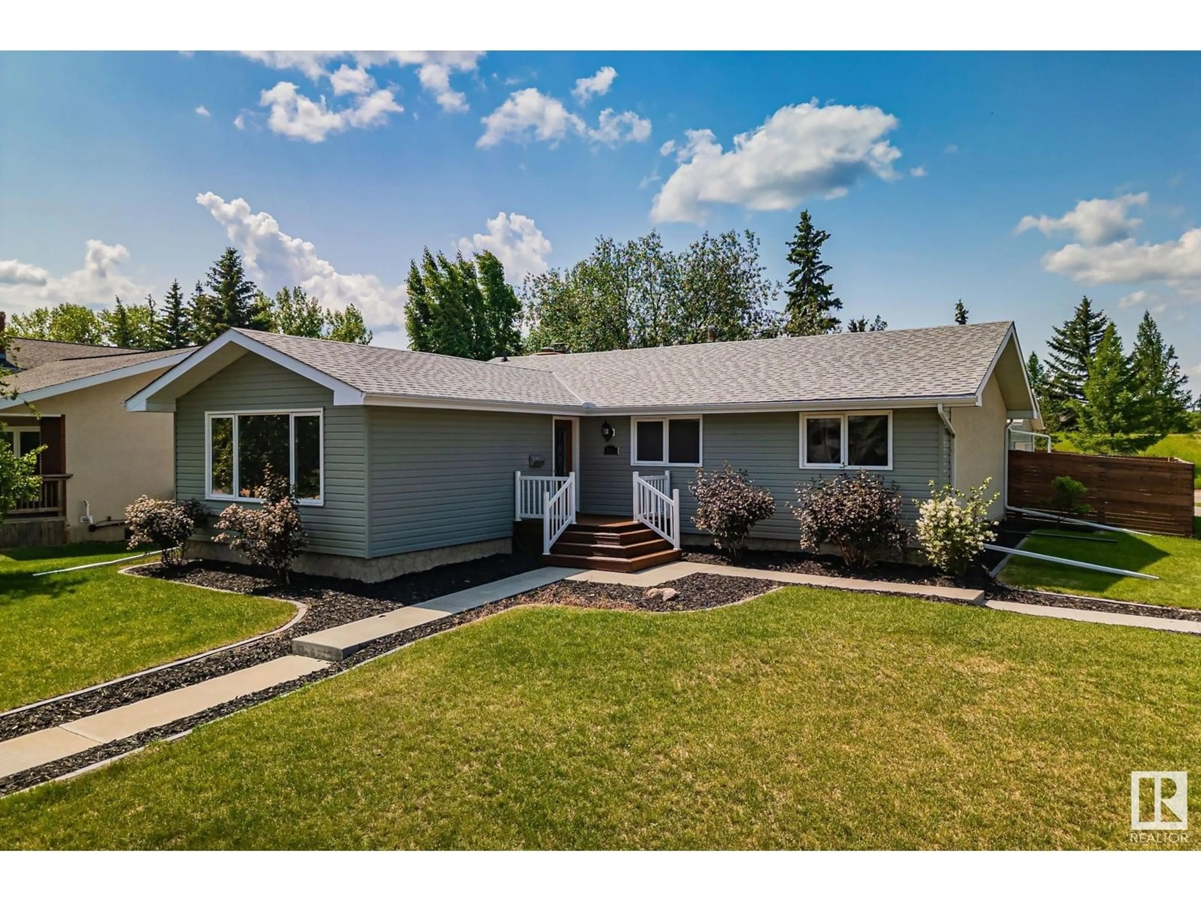 Home with vinyl exterior material, street for NW - 4916 144 ST, Edmonton Alberta T6H4G8