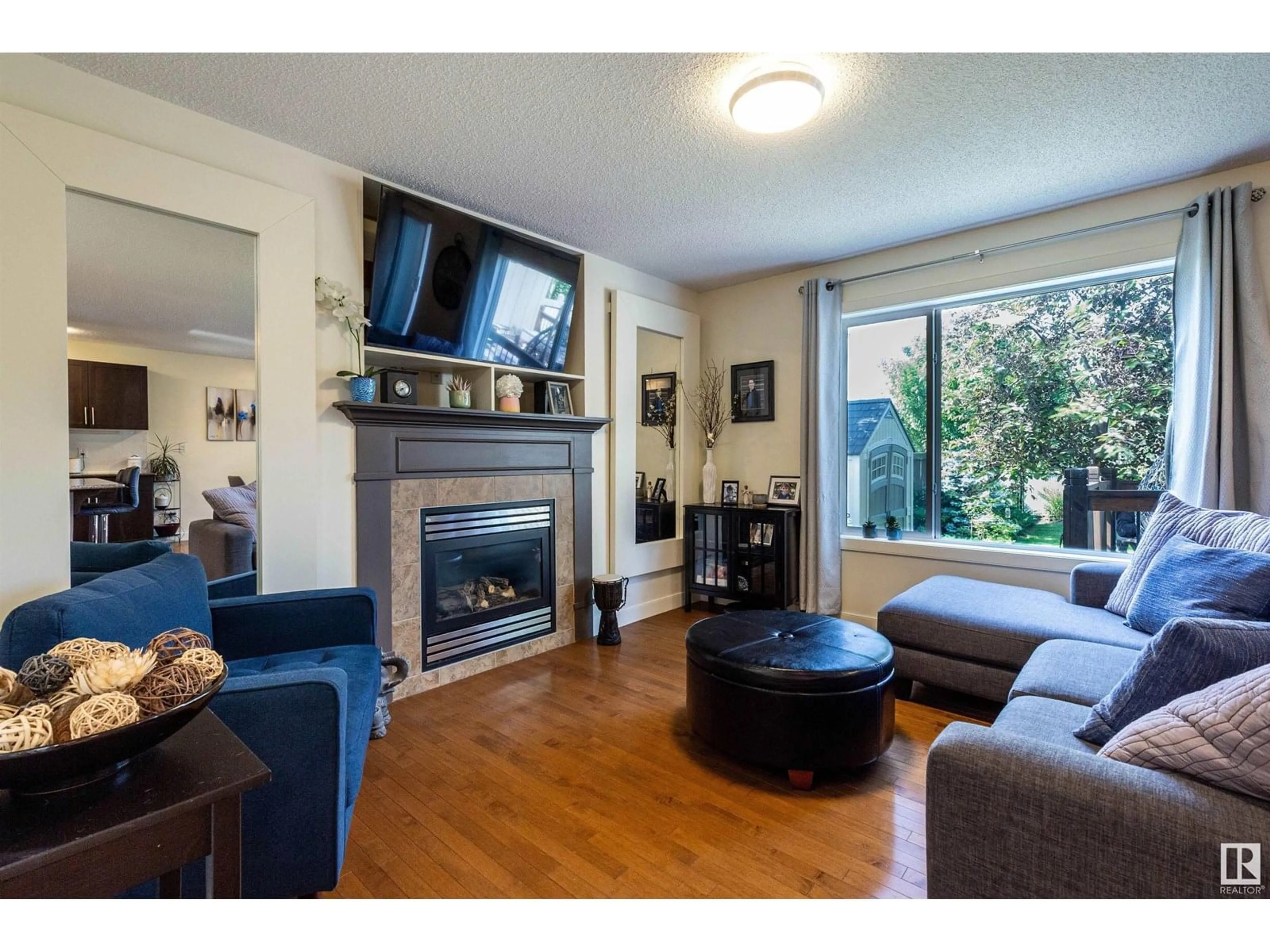 Living room with furniture, wood/laminate floor for 20042 131 AV, Edmonton Alberta T5S0E2