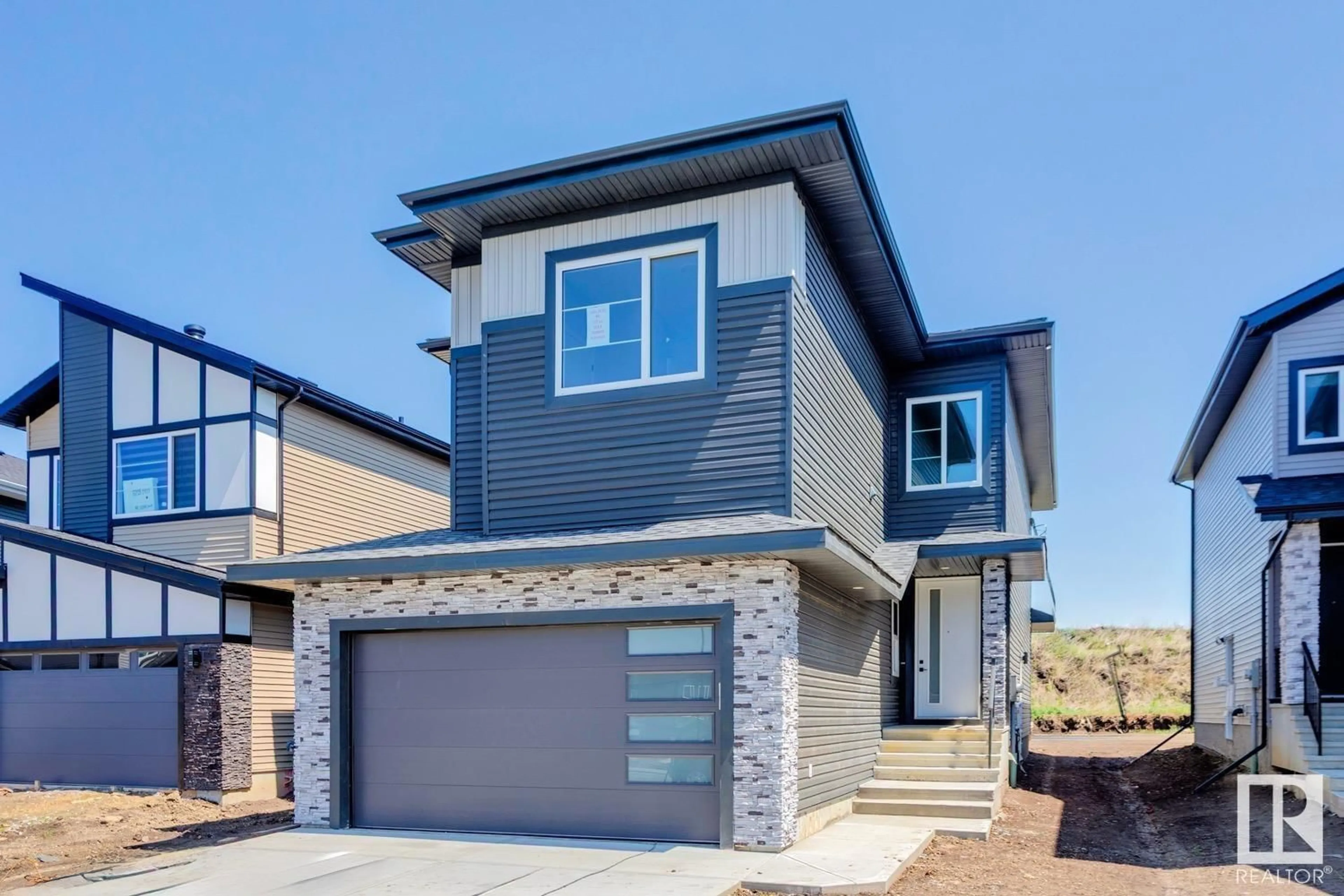 Home with vinyl exterior material, street for NE - 6221 19 ST, Rural Leduc County Alberta T4X3C8
