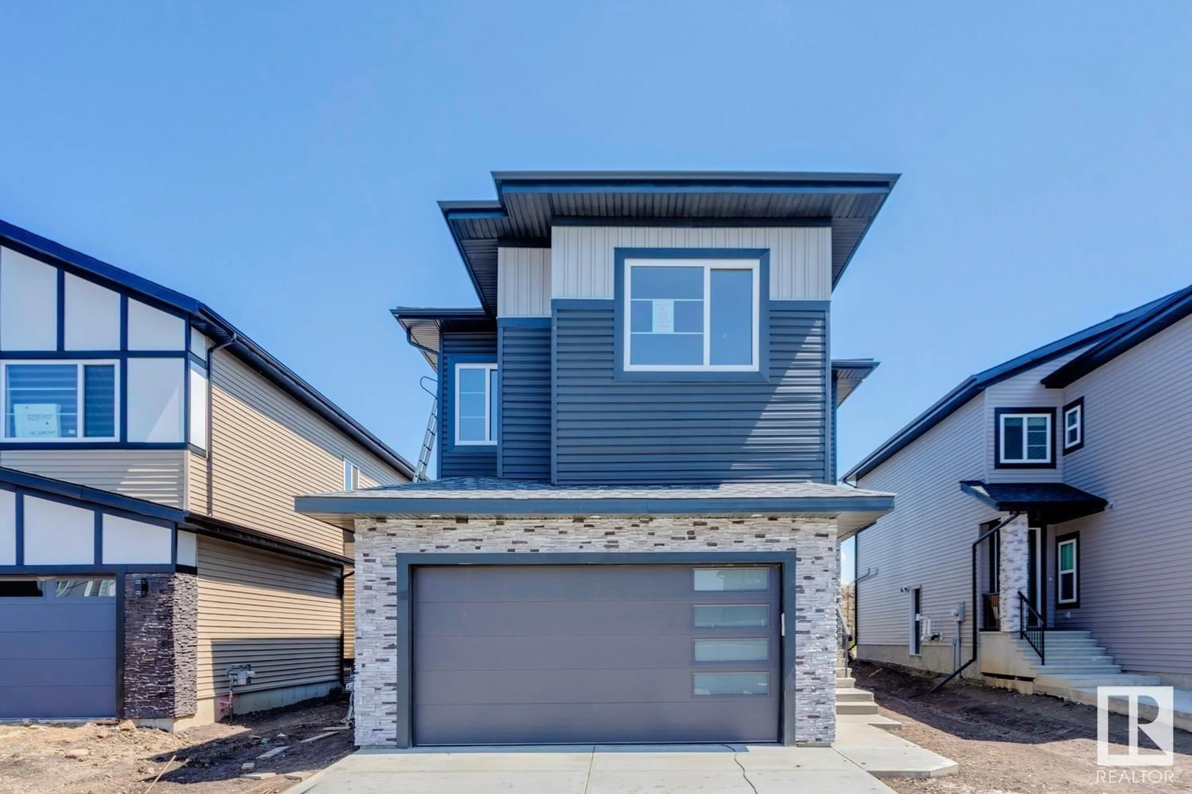 Home with vinyl exterior material, street for NE - 6221 19 ST, Rural Leduc County Alberta T4X3C8