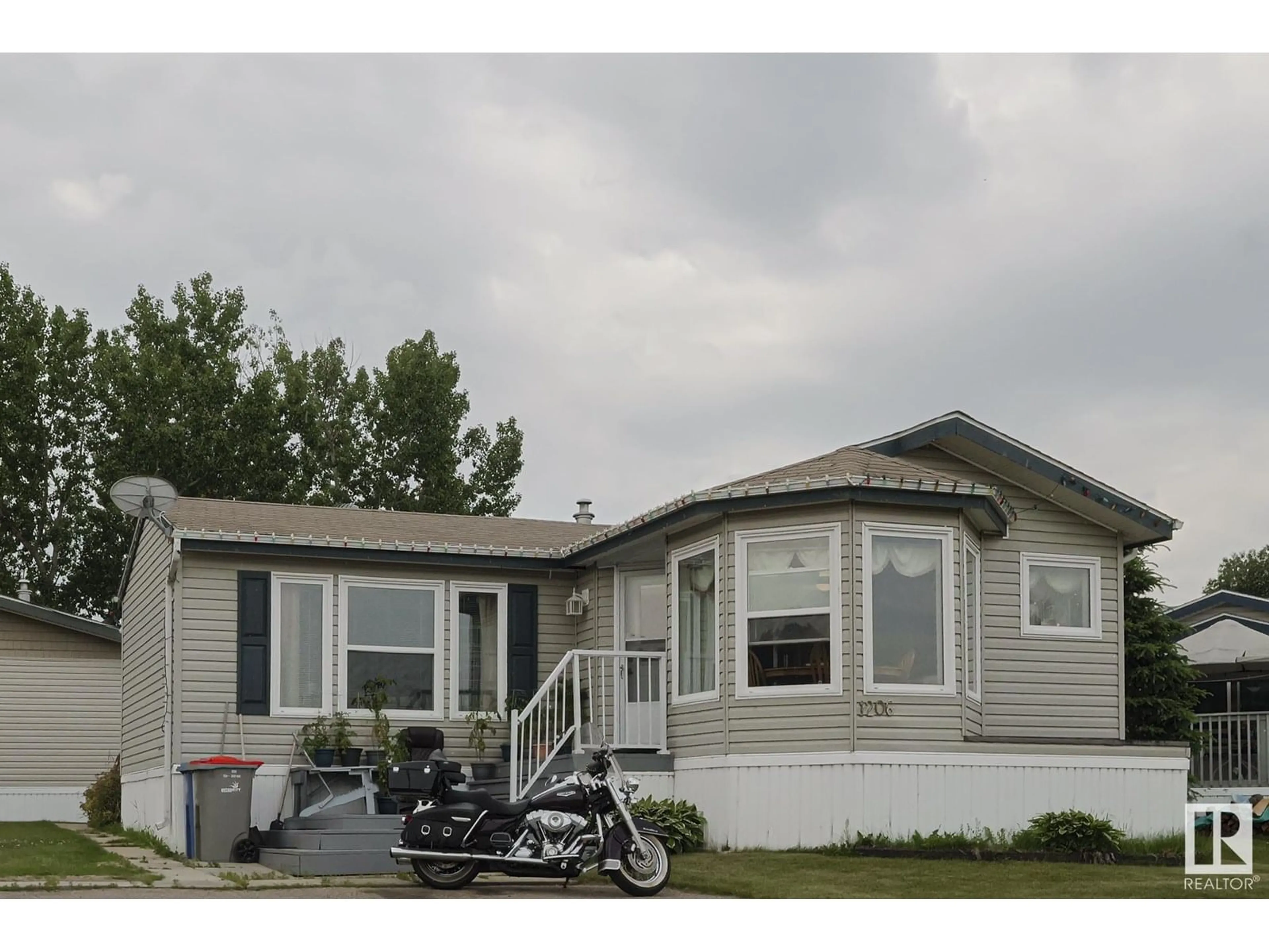 Home with vinyl exterior material, street for 53222 - 1206 RR 272, Rural Parkland County Alberta T7X4K4