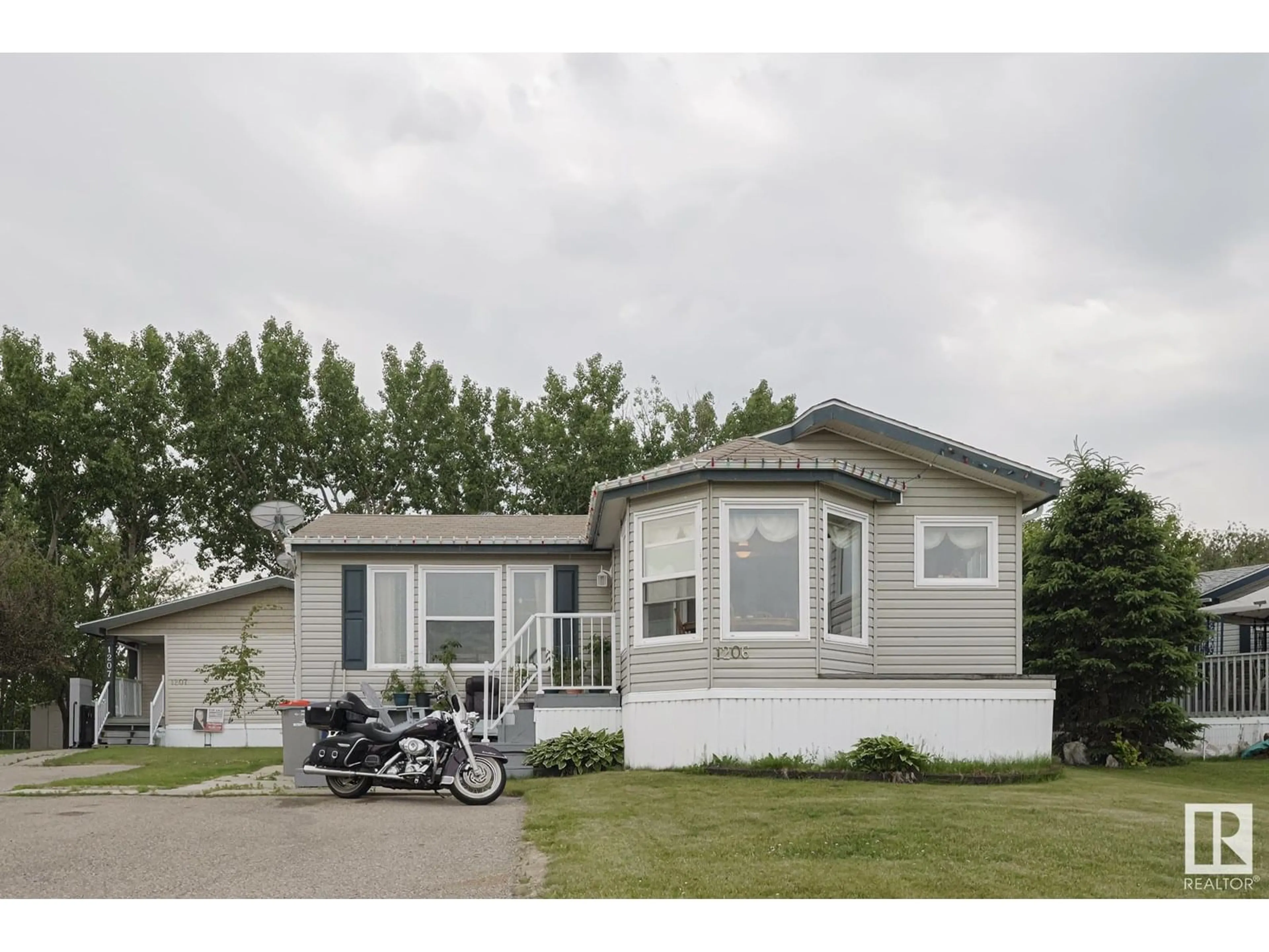 Home with vinyl exterior material, street for 53222 - 1206 RR 272, Rural Parkland County Alberta T7X4K4
