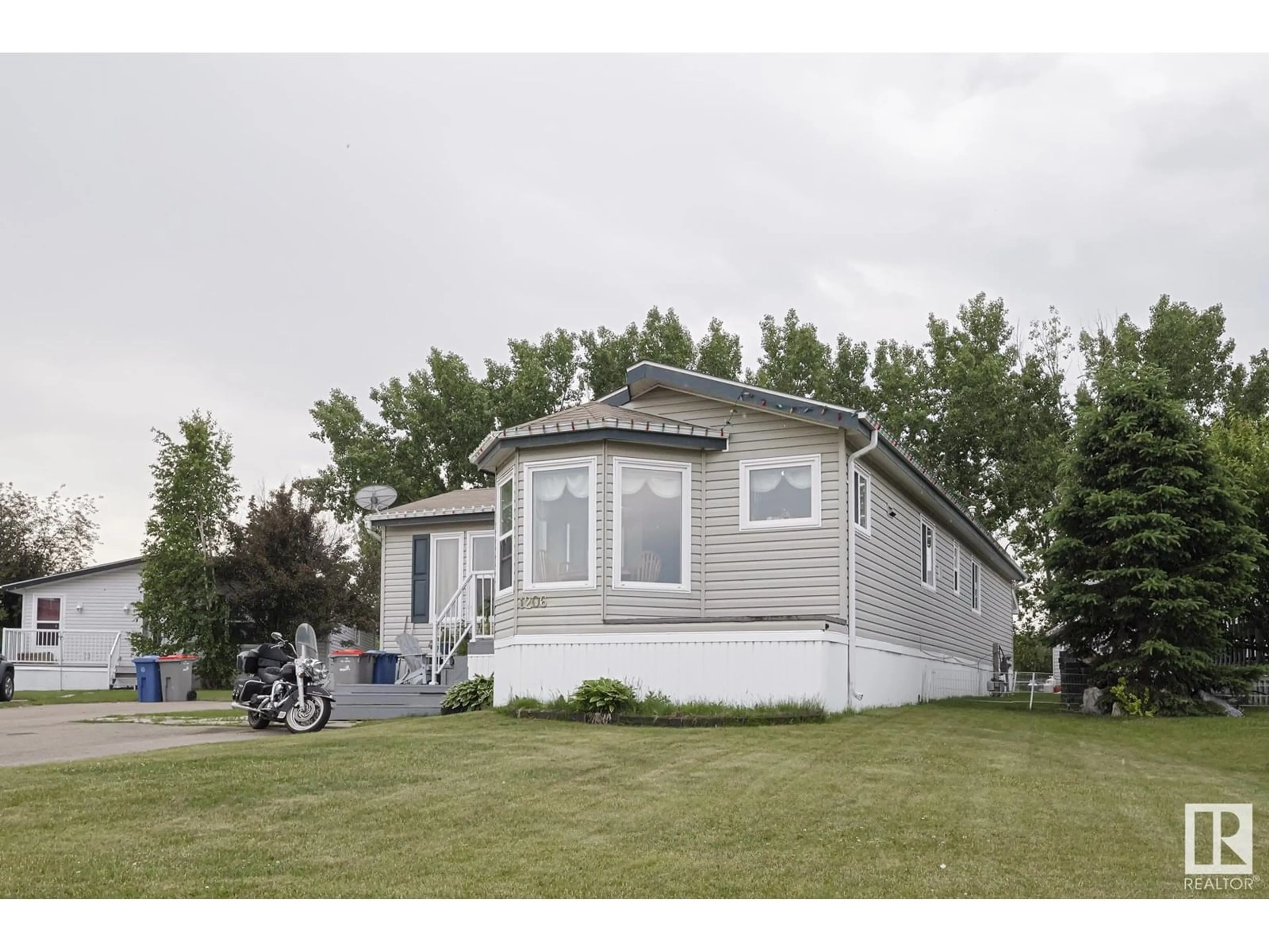 Home with vinyl exterior material, street for 53222 - 1206 RR 272, Rural Parkland County Alberta T7X4K4