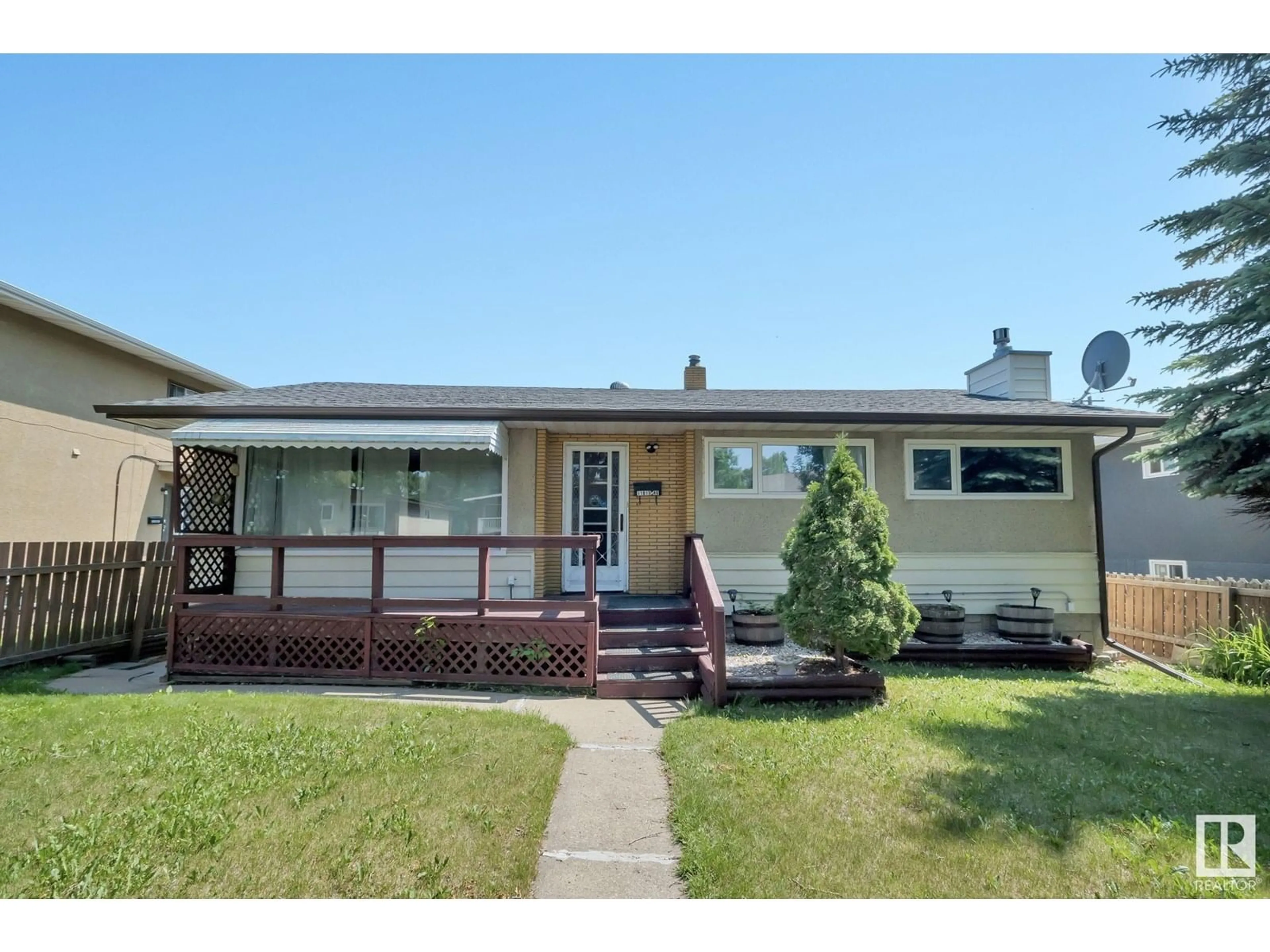 Home with vinyl exterior material, street for NW - 11815 46 ST, Edmonton Alberta T5W2V6