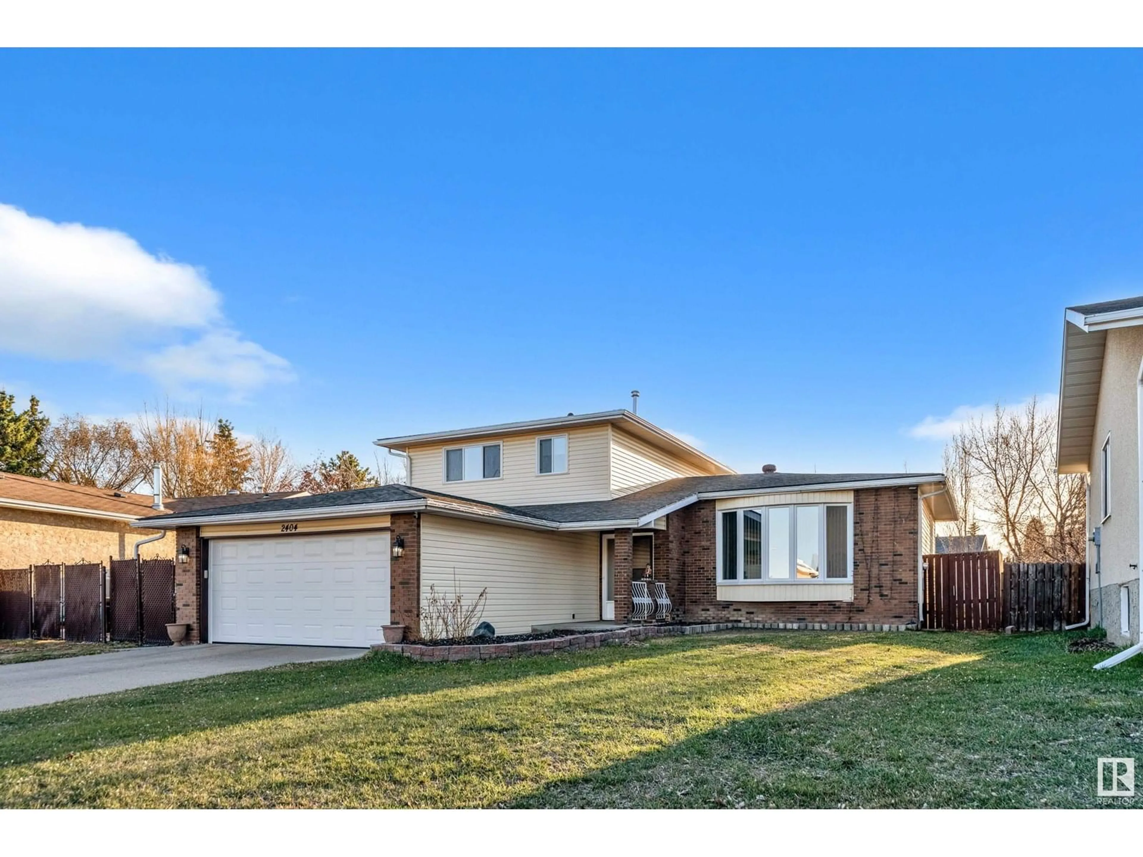 Home with brick exterior material, street for 2404 80 ST, Edmonton Alberta T6K3P6