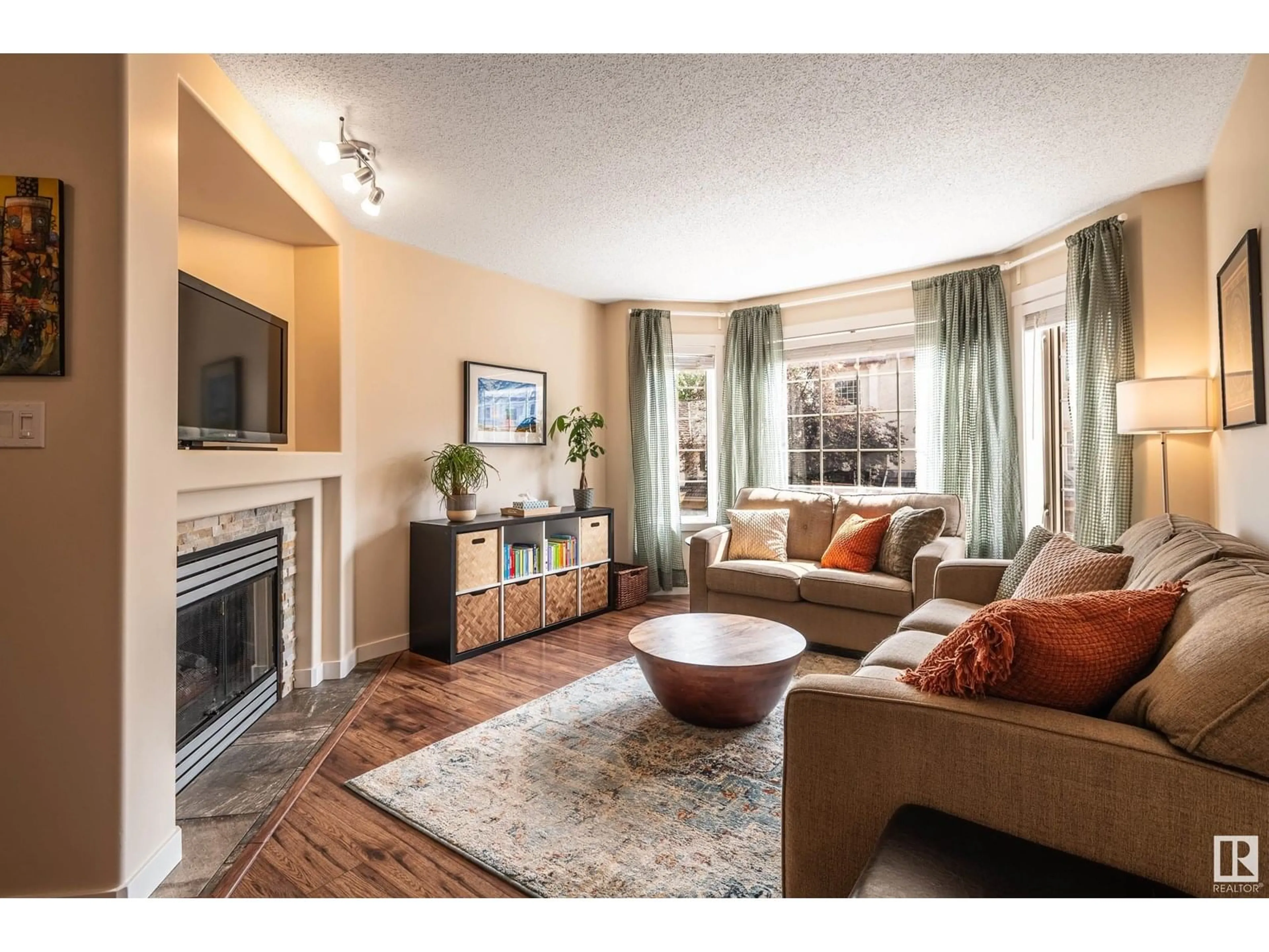 Living room with furniture, wood/laminate floor for #29 - 1237 CARTER CREST RD, Edmonton Alberta T6R2R2
