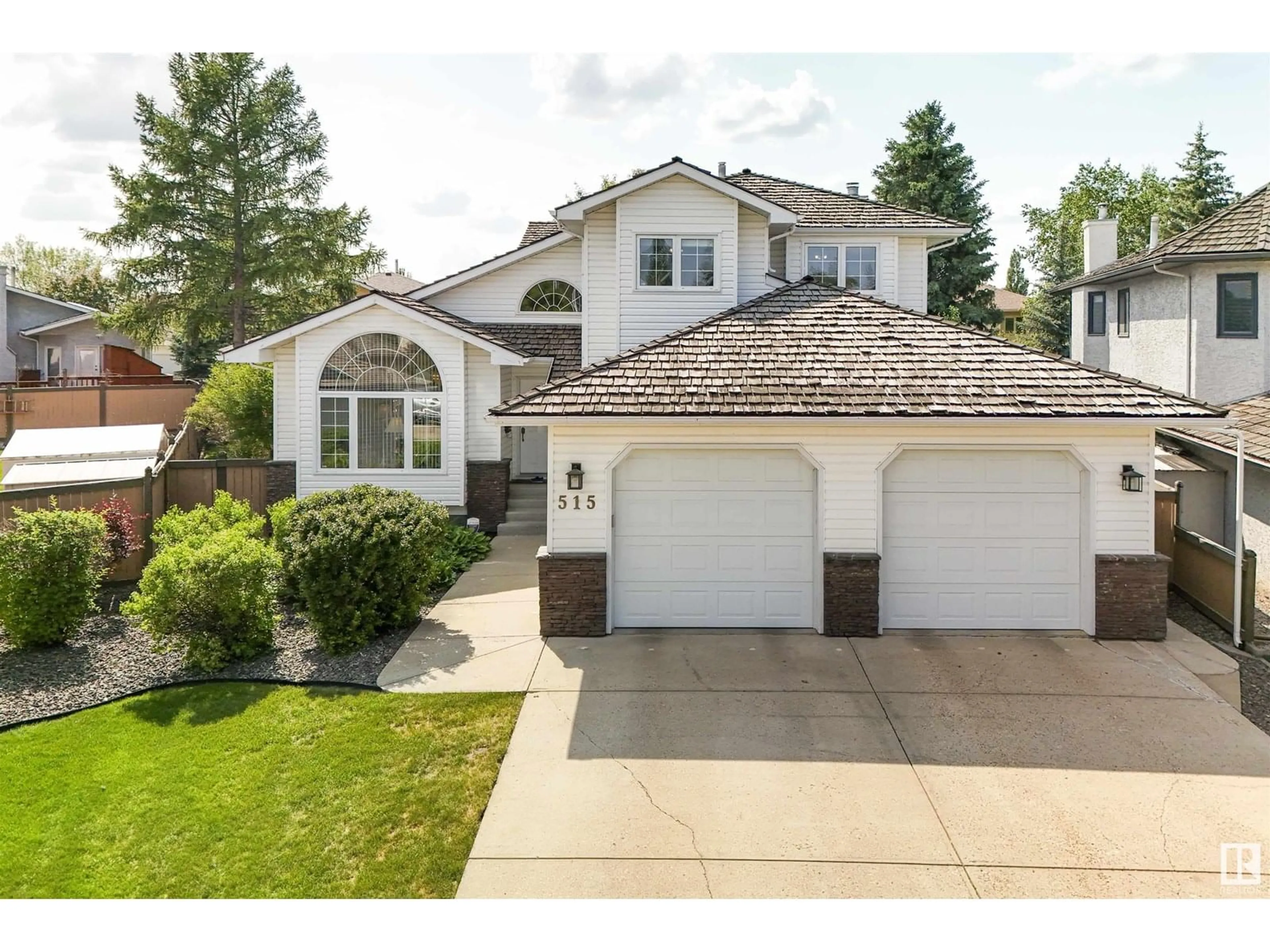 Home with vinyl exterior material, street for 515 BUCHANAN RD, Edmonton Alberta T6R2B5
