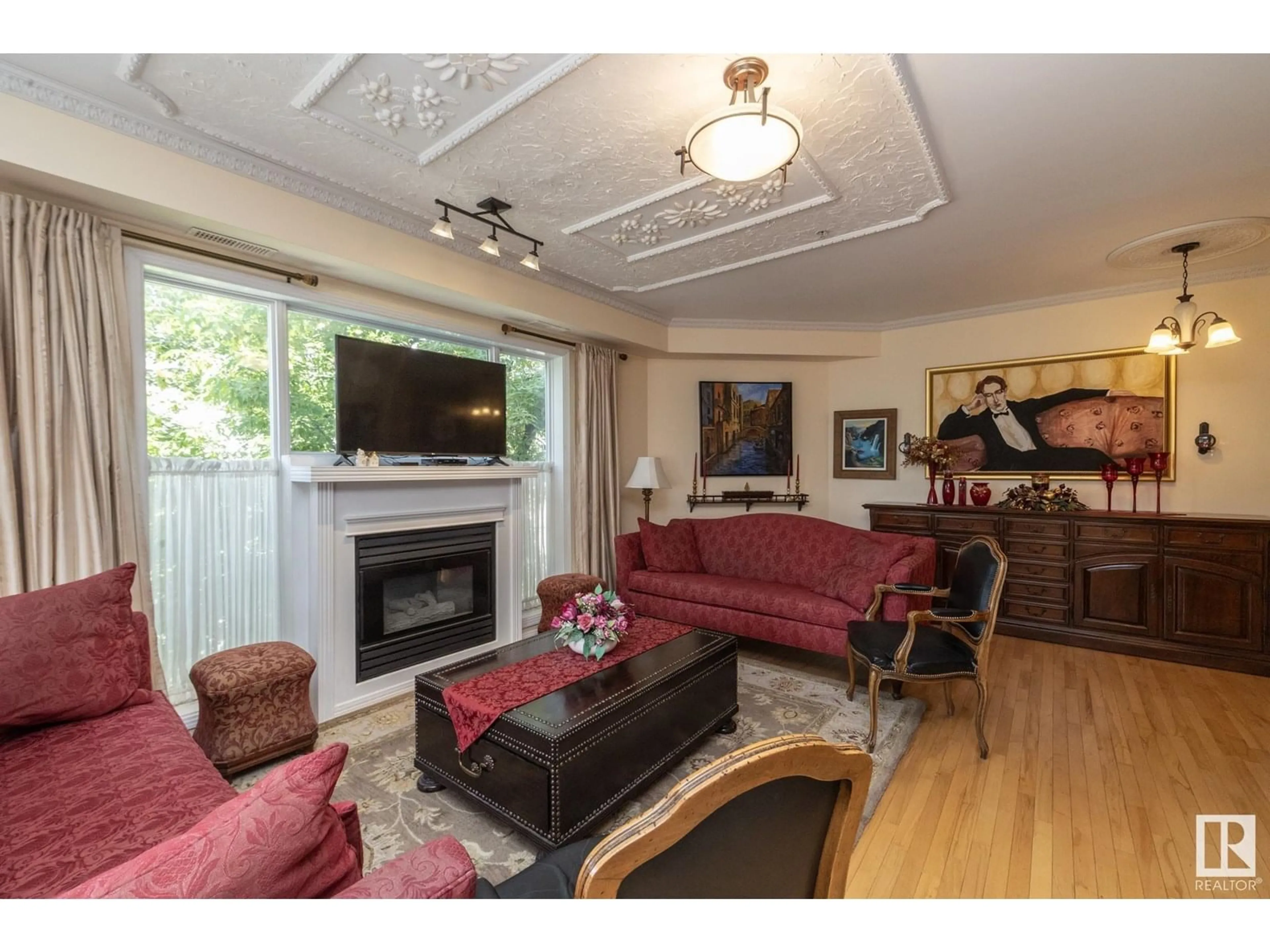Living room with furniture, wood/laminate floor for 206 - 10939 82 AV, Edmonton Alberta T6G0S7