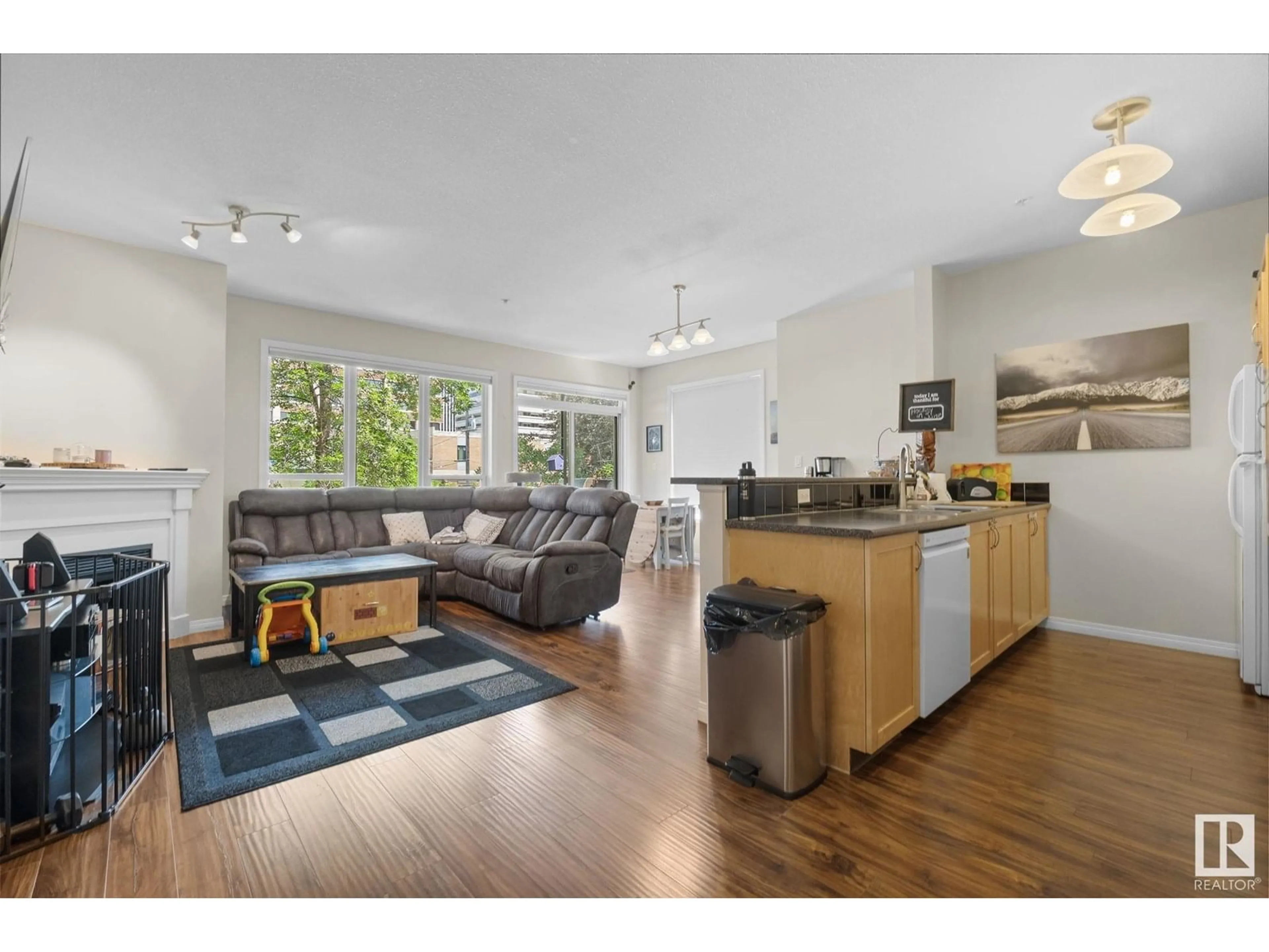 Open concept kitchen, wood/laminate floor for 232 10023 110 ST NW, Edmonton Alberta T5K1J5