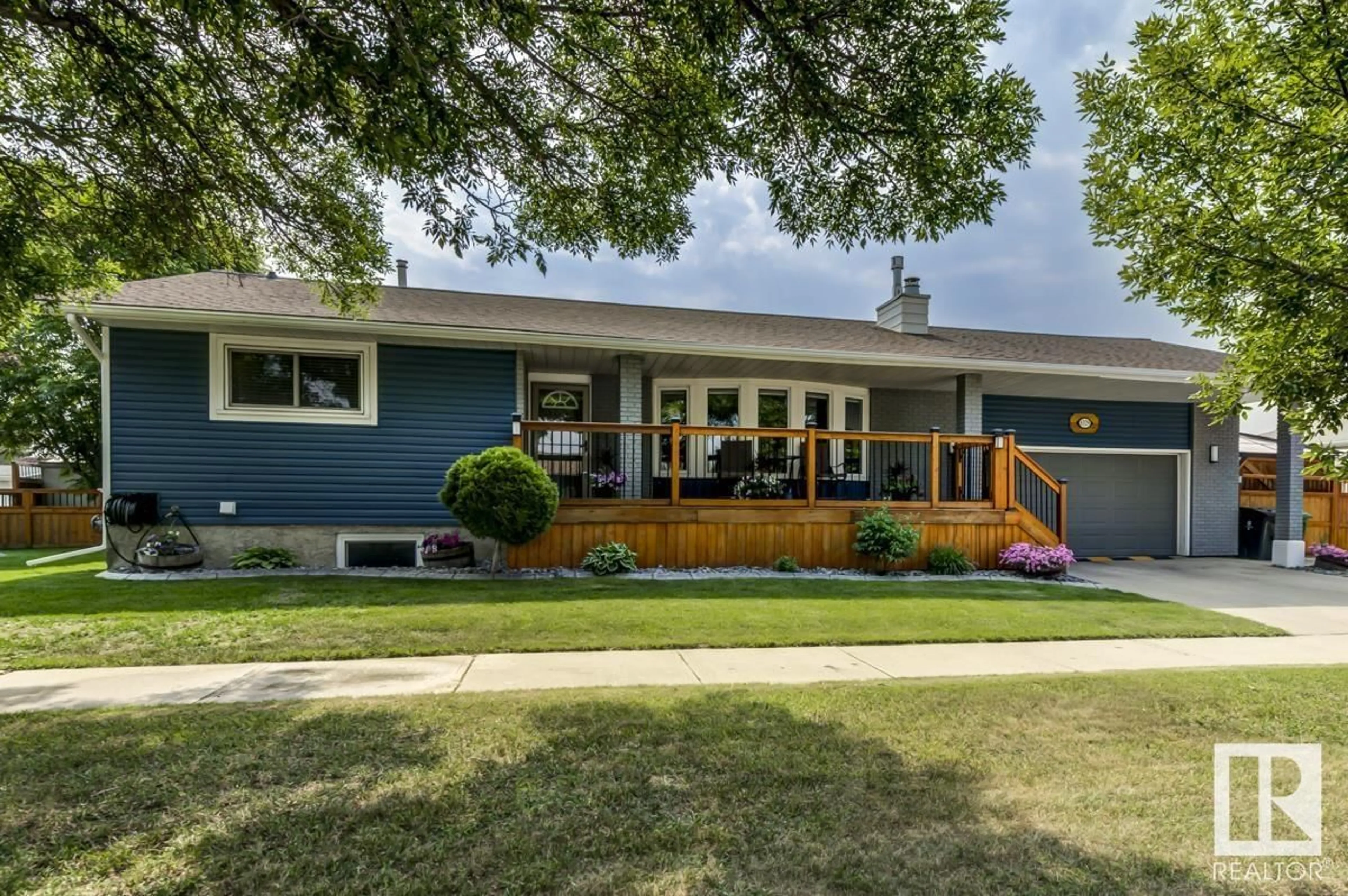 Home with vinyl exterior material, street for 8329 99 AV, Fort Saskatchewan Alberta T8L3E4