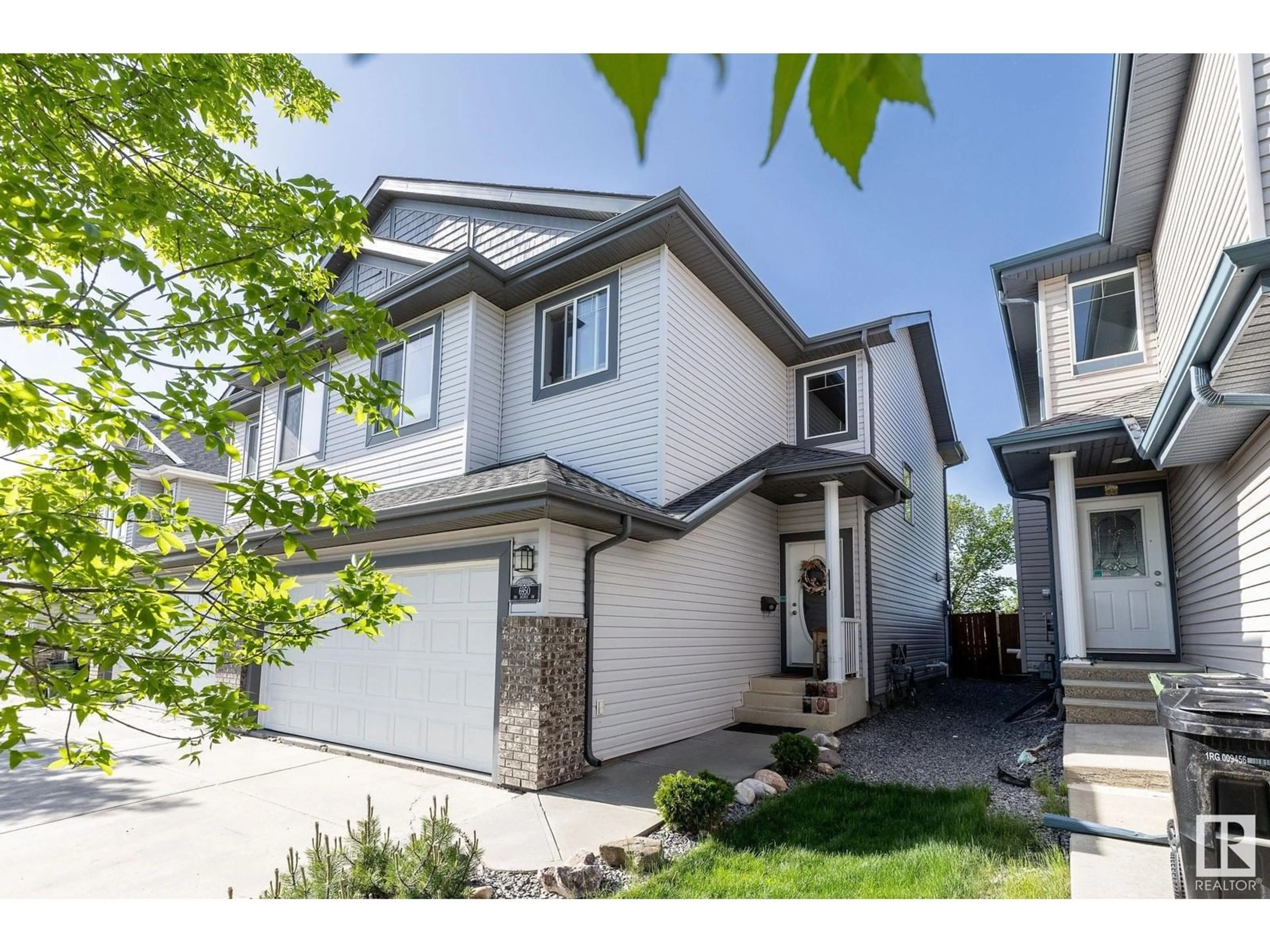 Home with vinyl exterior material, street for 6950 19A AV, Edmonton Alberta T6X0L7
