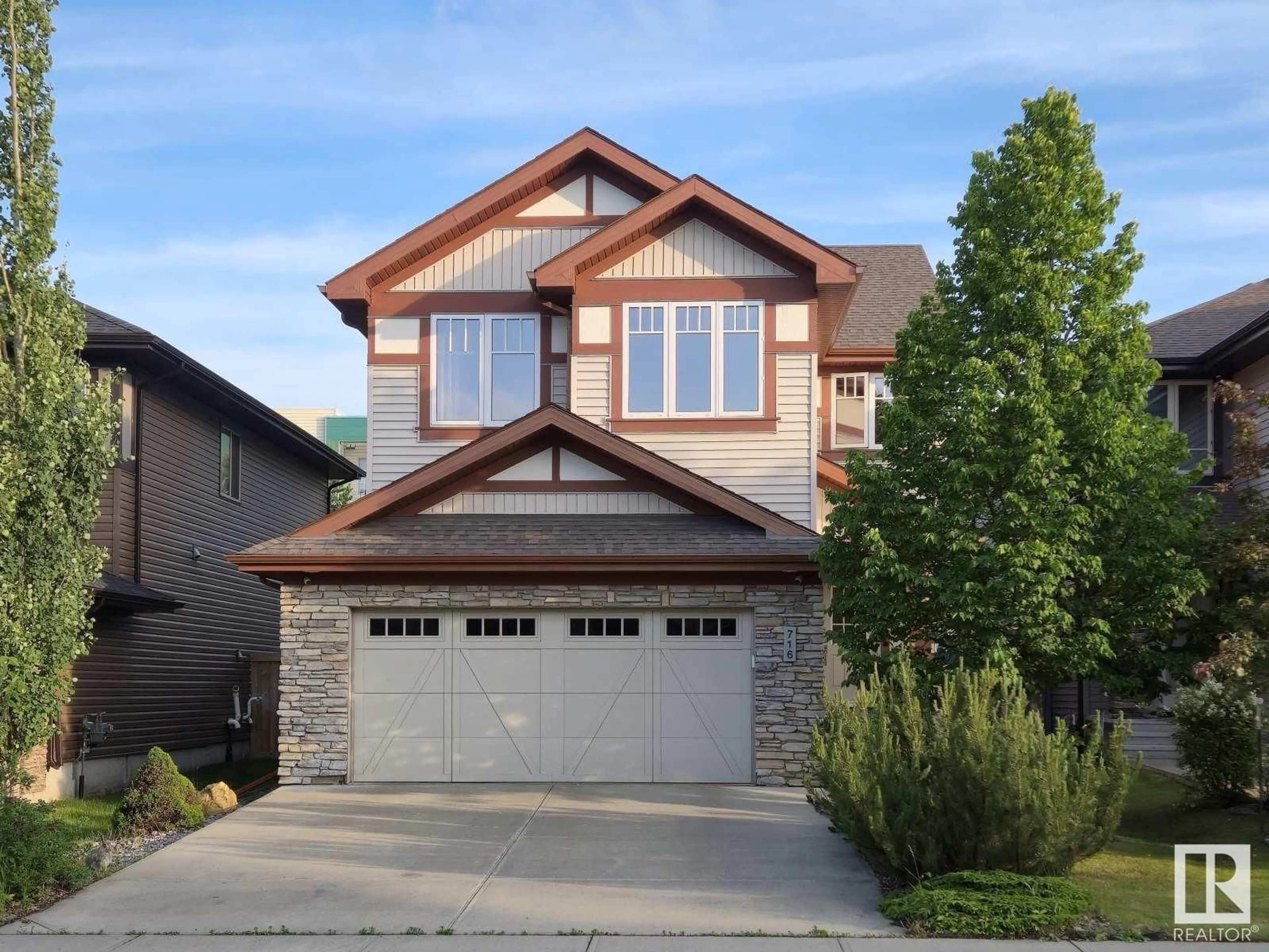 Home with vinyl exterior material, street for 716 ADAMS WY, Edmonton Alberta T6W0K2