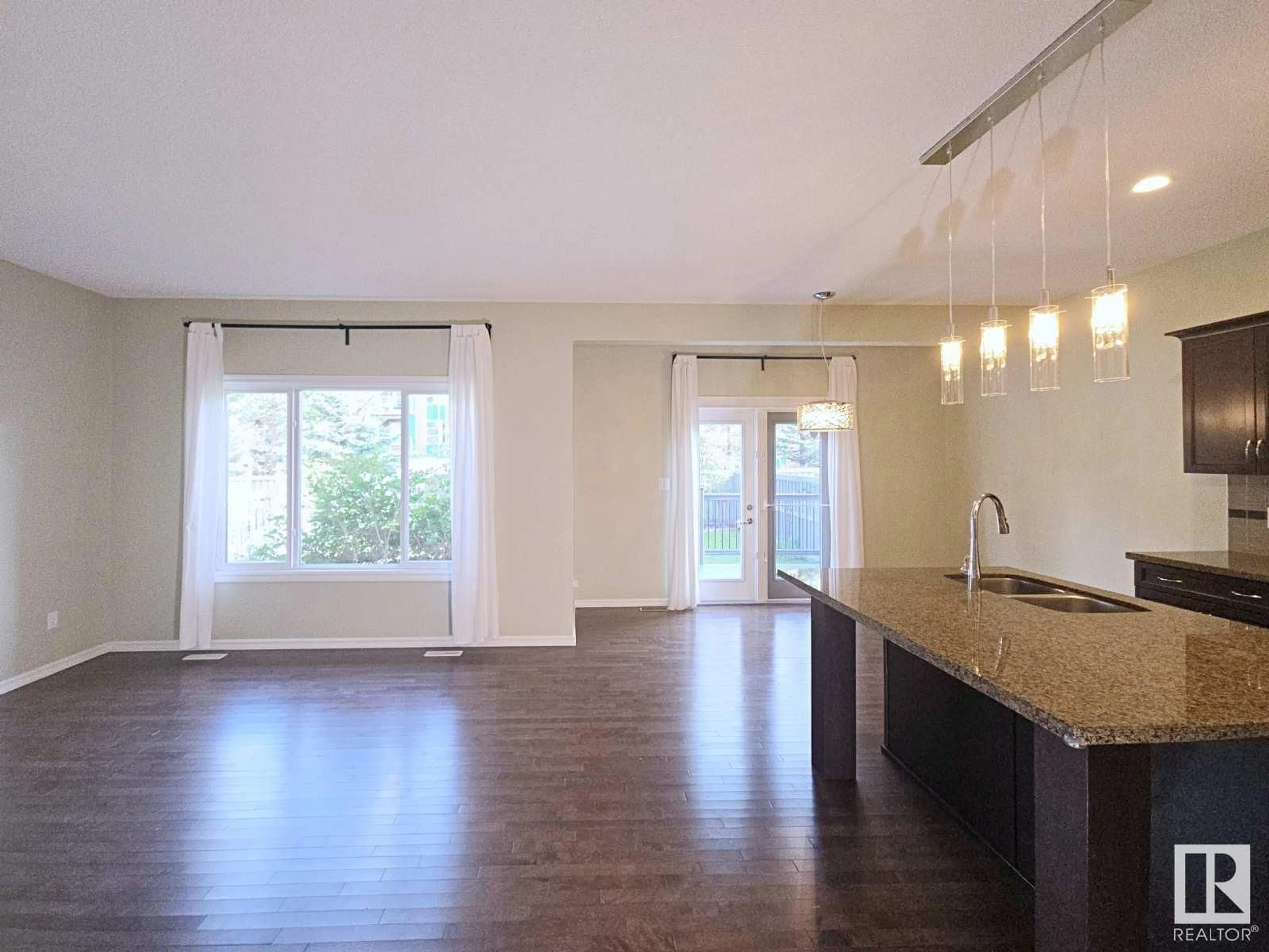 Open concept kitchen, wood/laminate floor for 716 ADAMS WY, Edmonton Alberta T6W0K2