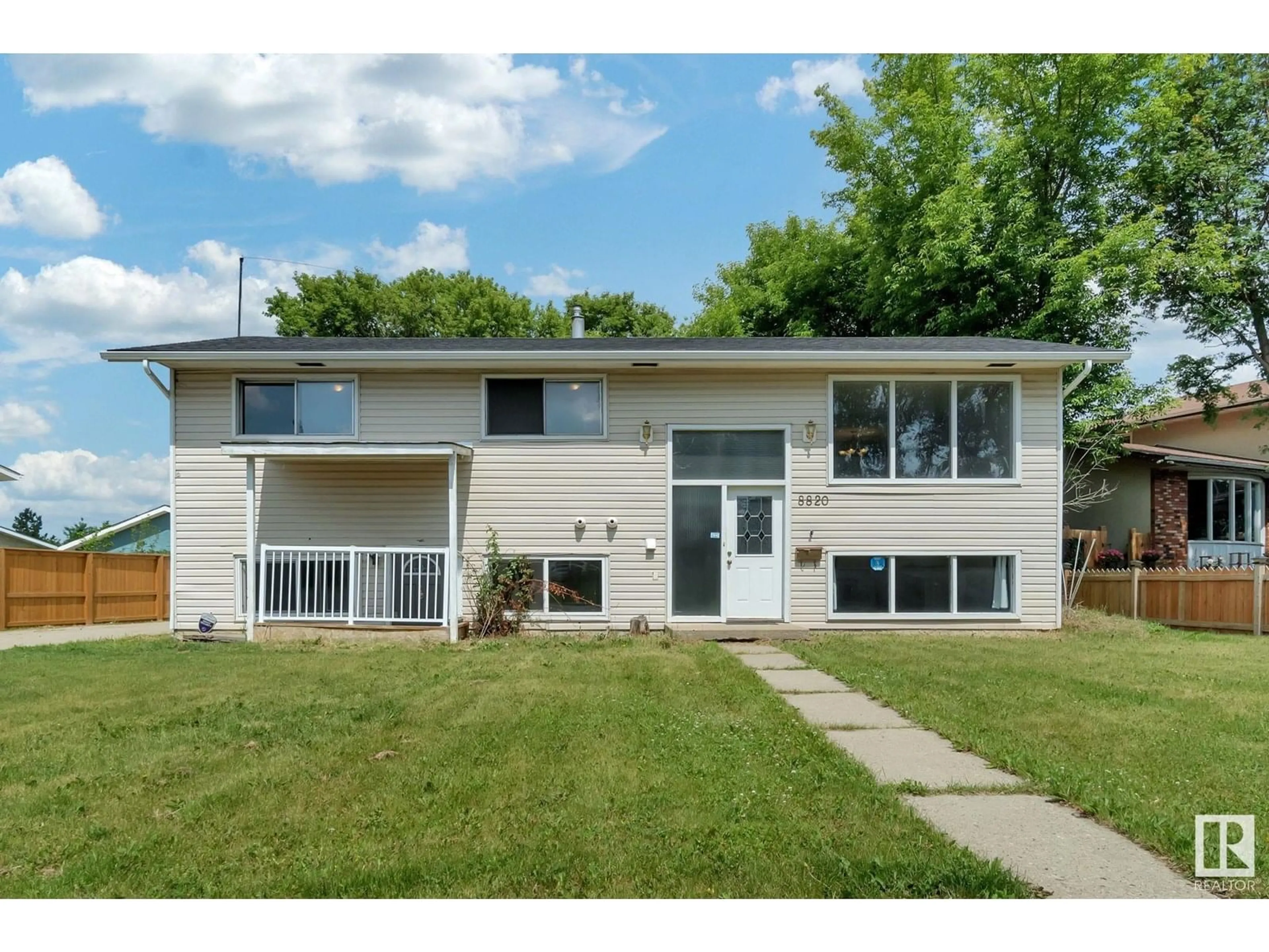 Home with vinyl exterior material, street for 8820 31 AV, Edmonton Alberta T6K3A6