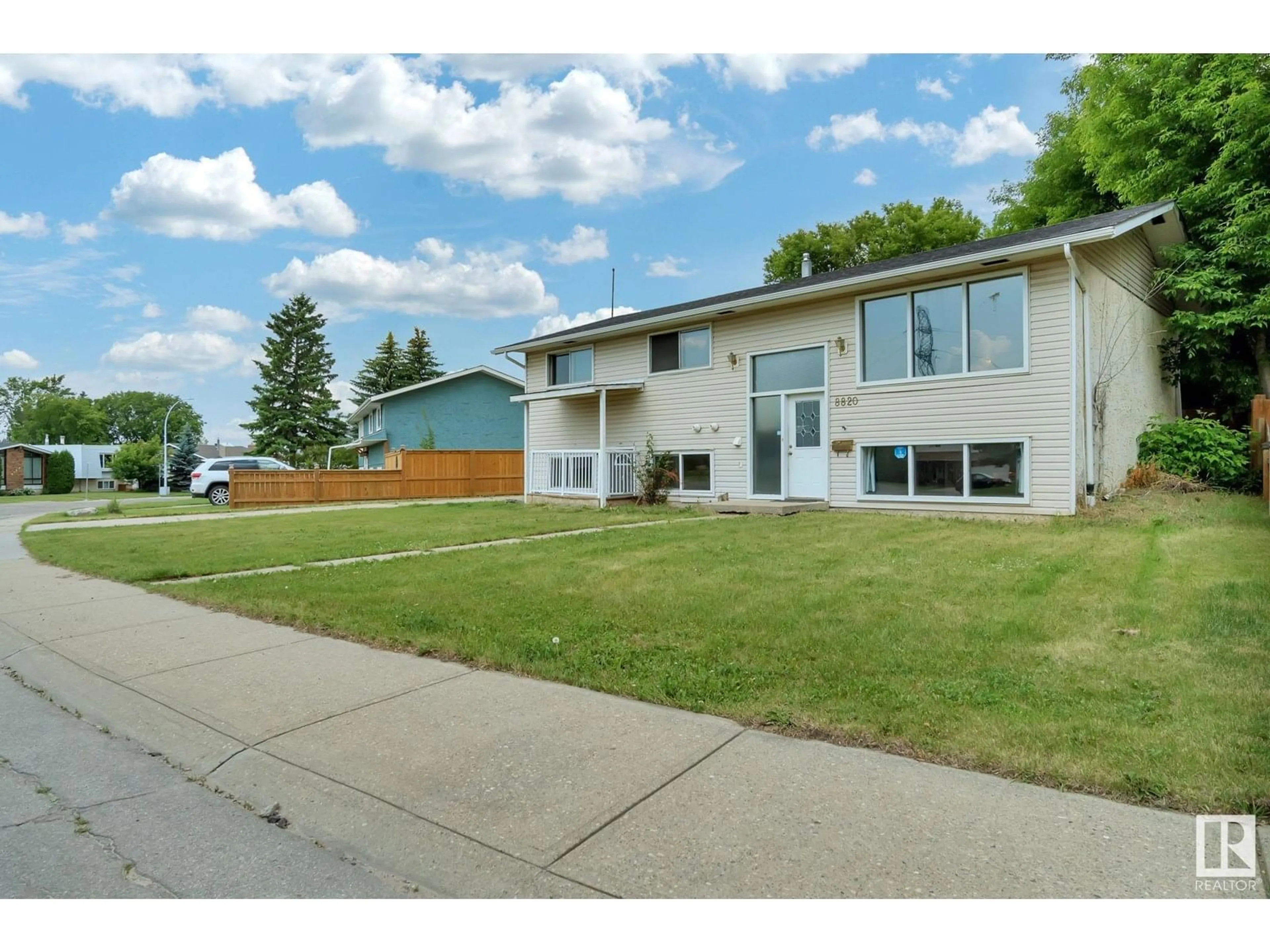 Home with vinyl exterior material, street for 8820 31 AV, Edmonton Alberta T6K3A6