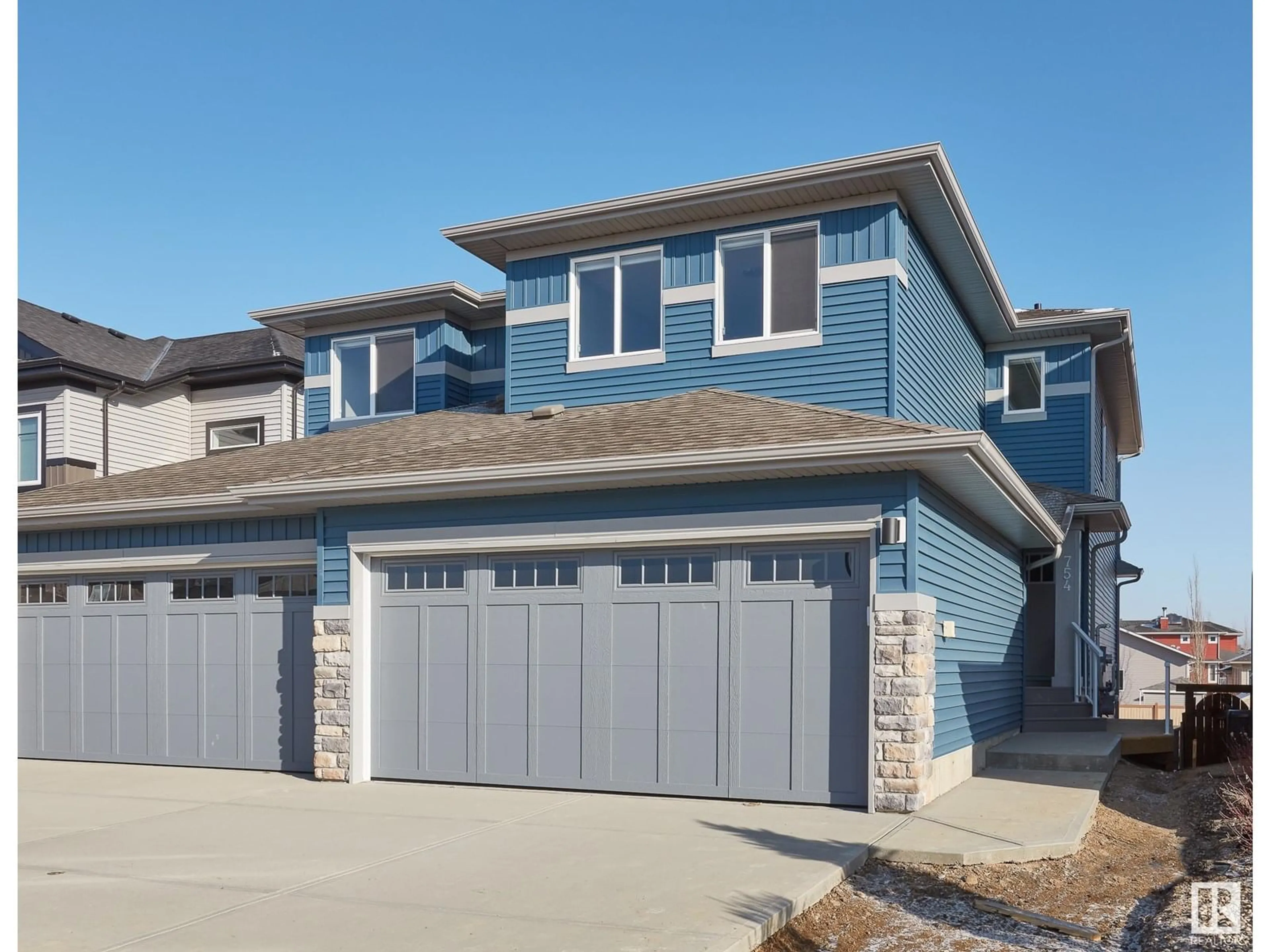 Home with vinyl exterior material, street for 754 BERG LO, Leduc Alberta T9E1G7