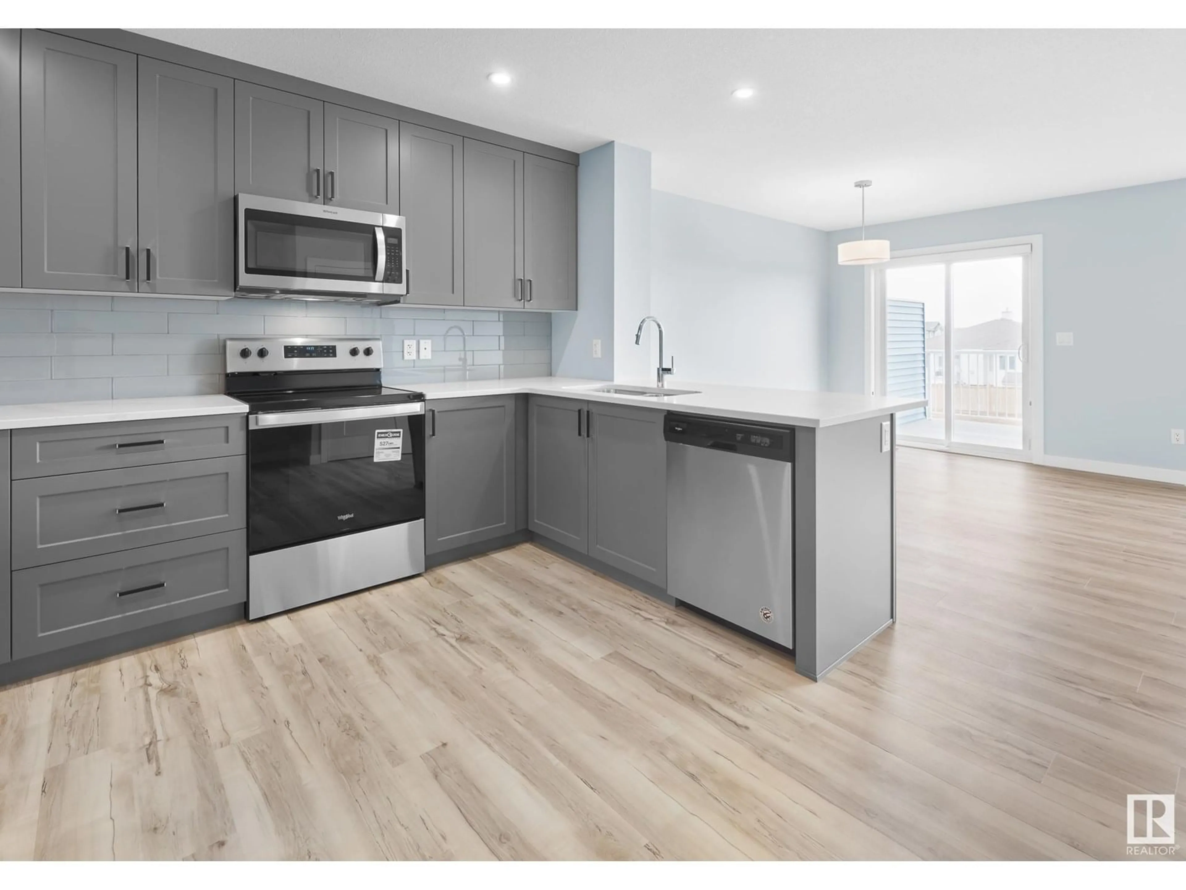 Open concept kitchen, wood/laminate floor for 754 BERG LO, Leduc Alberta T9E1G7