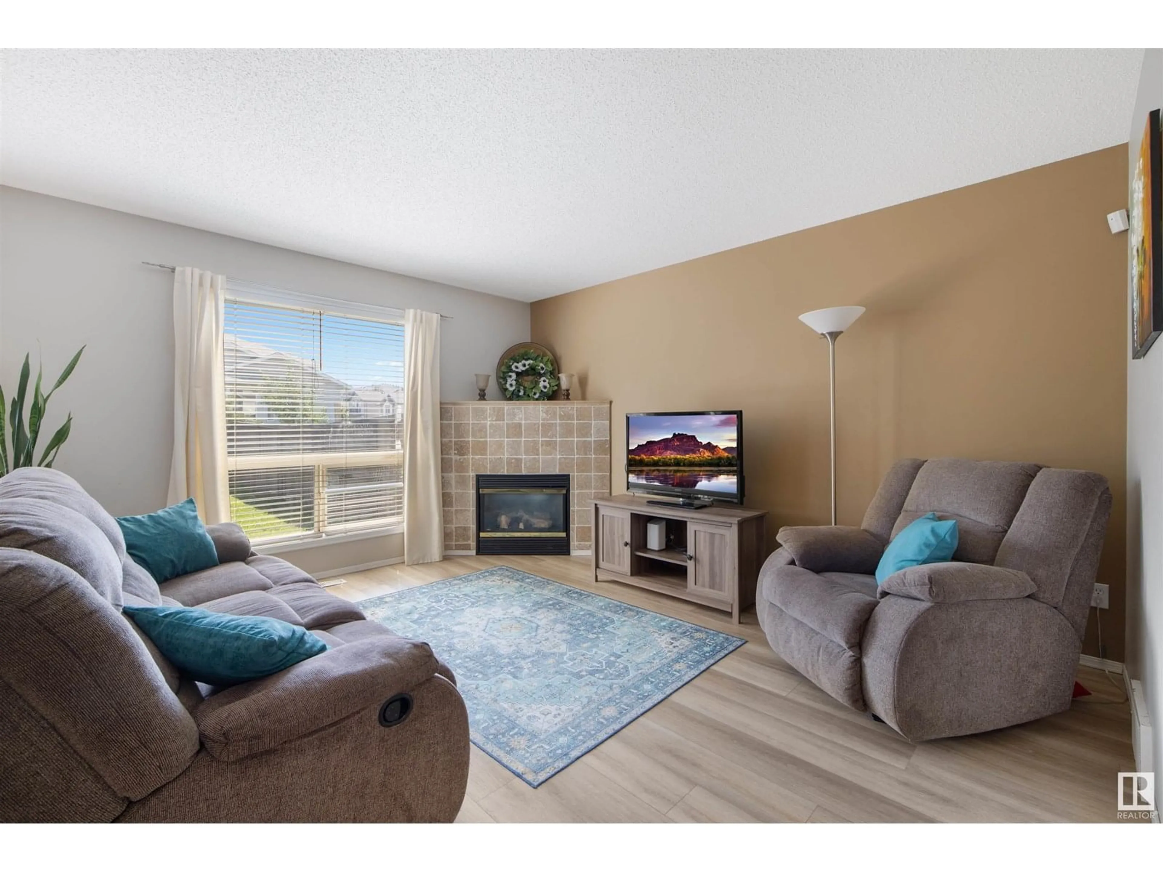 Living room with furniture, wood/laminate floor for 13077 162A AV, Edmonton Alberta T6V1W1