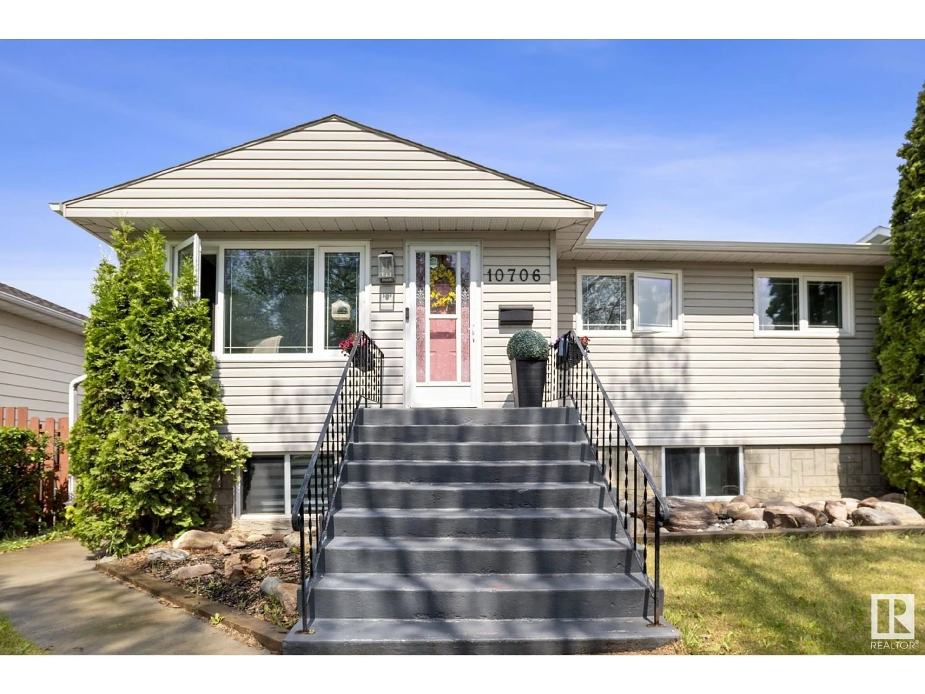 Home with vinyl exterior material, street for 10706 129 AV, Edmonton Alberta T5E0L4