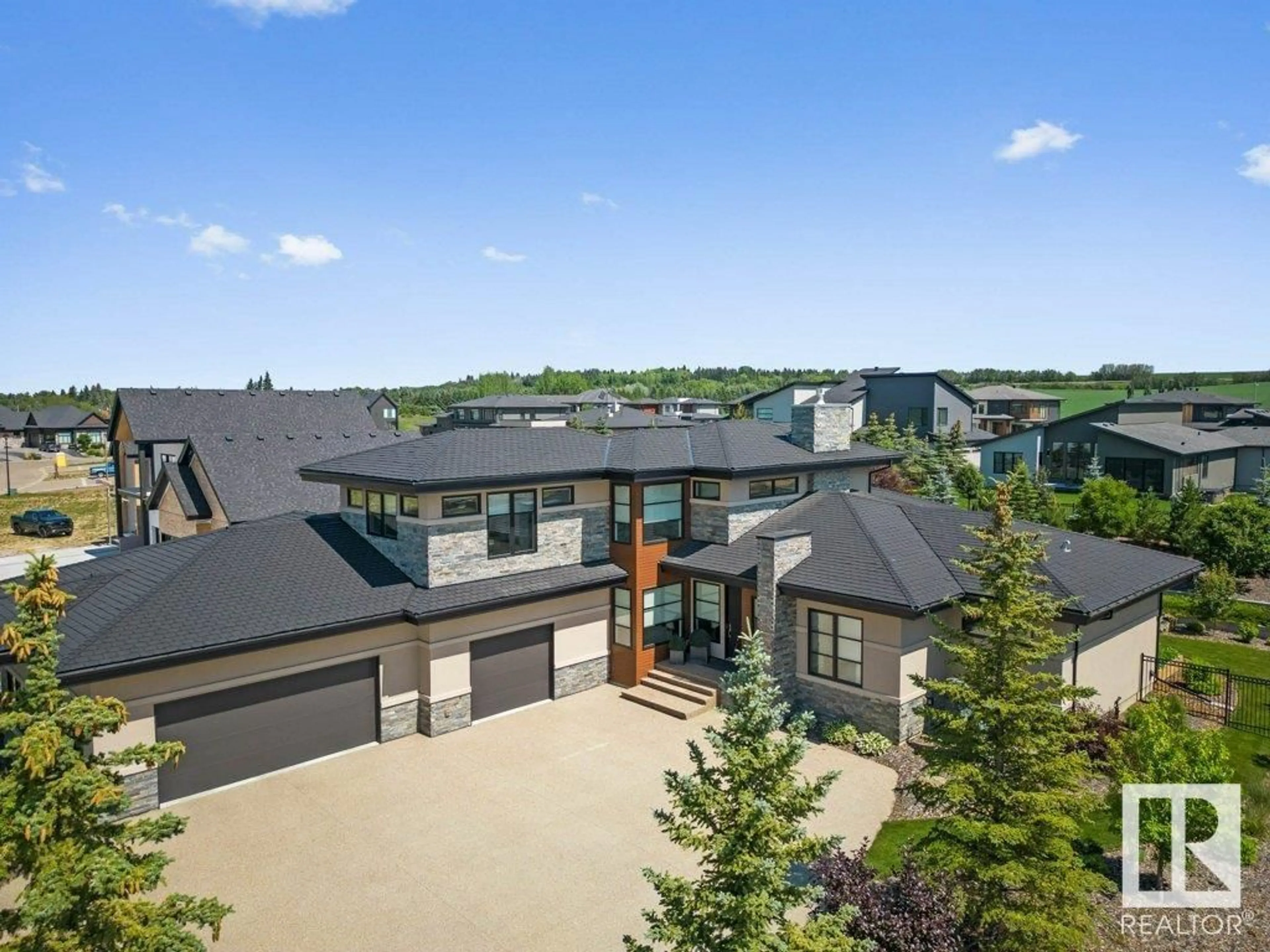 A pic from outside/outdoor area/front of a property/back of a property/a pic from drone, mountain view for #212 - 25122 STURGEON RD, Rural Sturgeon County Alberta T8T1S6