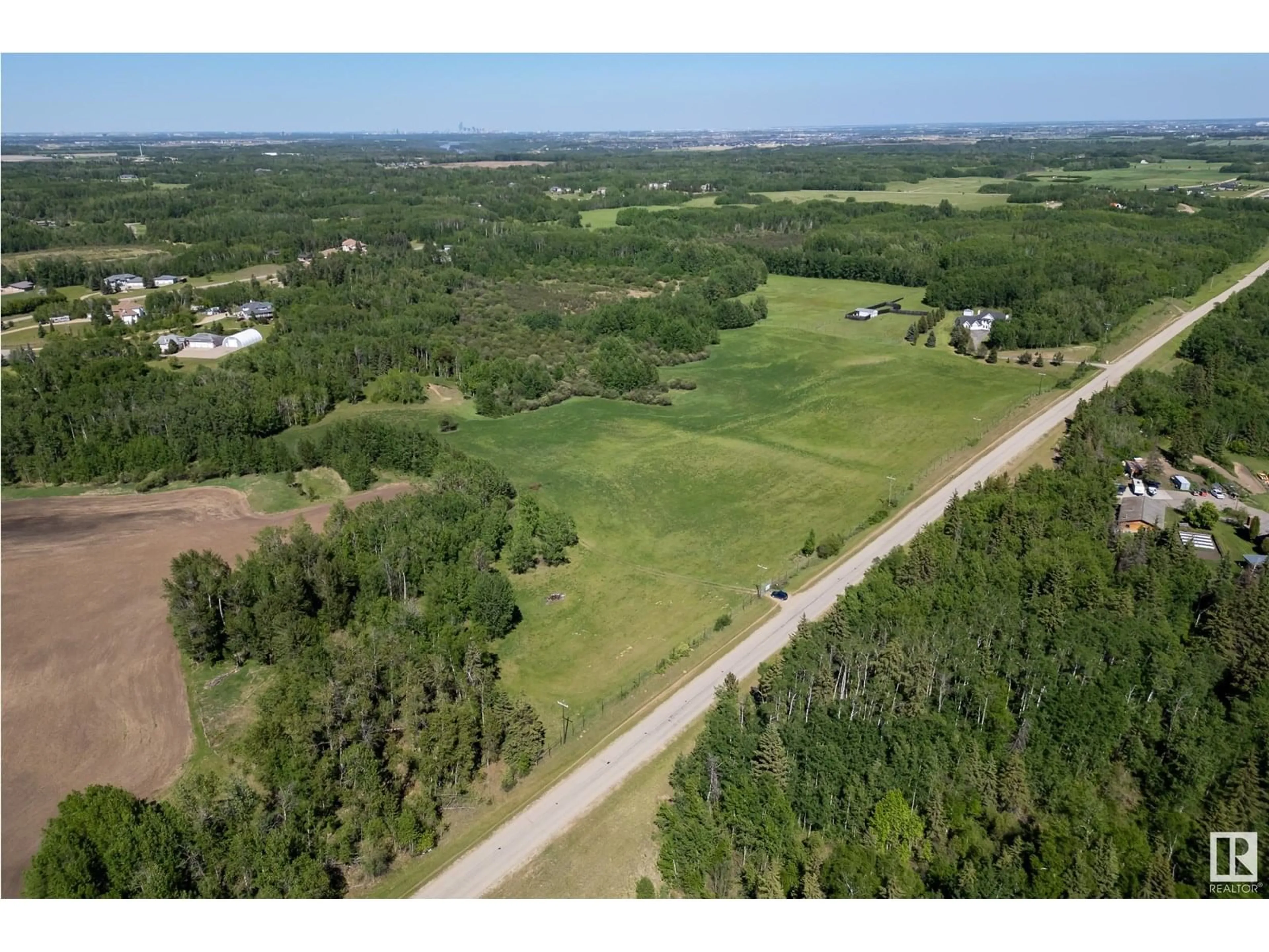 A pic from outside/outdoor area/front of a property/back of a property/a pic from drone, forest/trees view for A - 26020 TWP RD 511, Rural Parkland County Alberta T7Y1B2