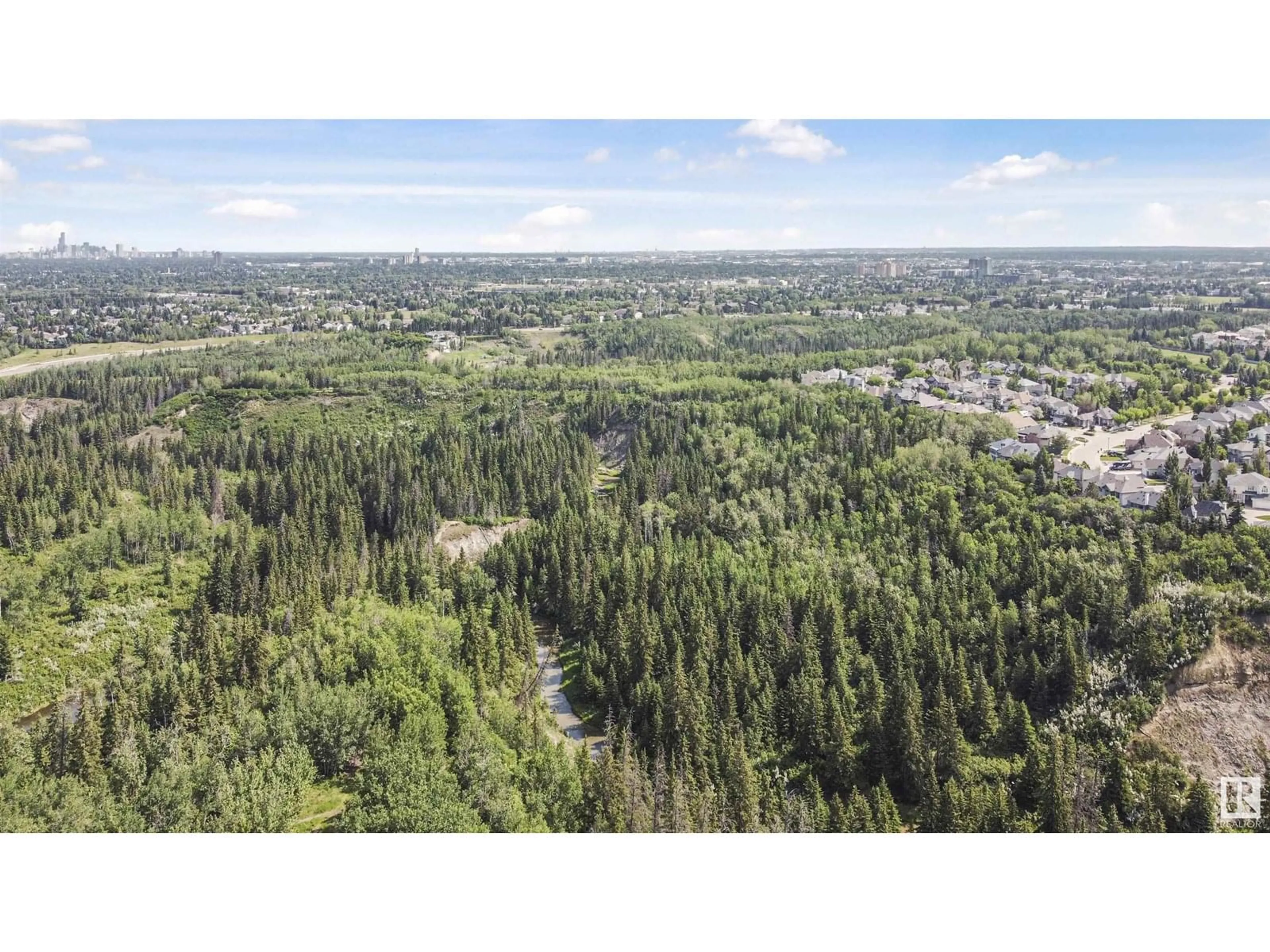 A pic from outside/outdoor area/front of a property/back of a property/a pic from drone, forest/trees view for 415 - 7463 MAY CM, Edmonton Alberta T6R0X1