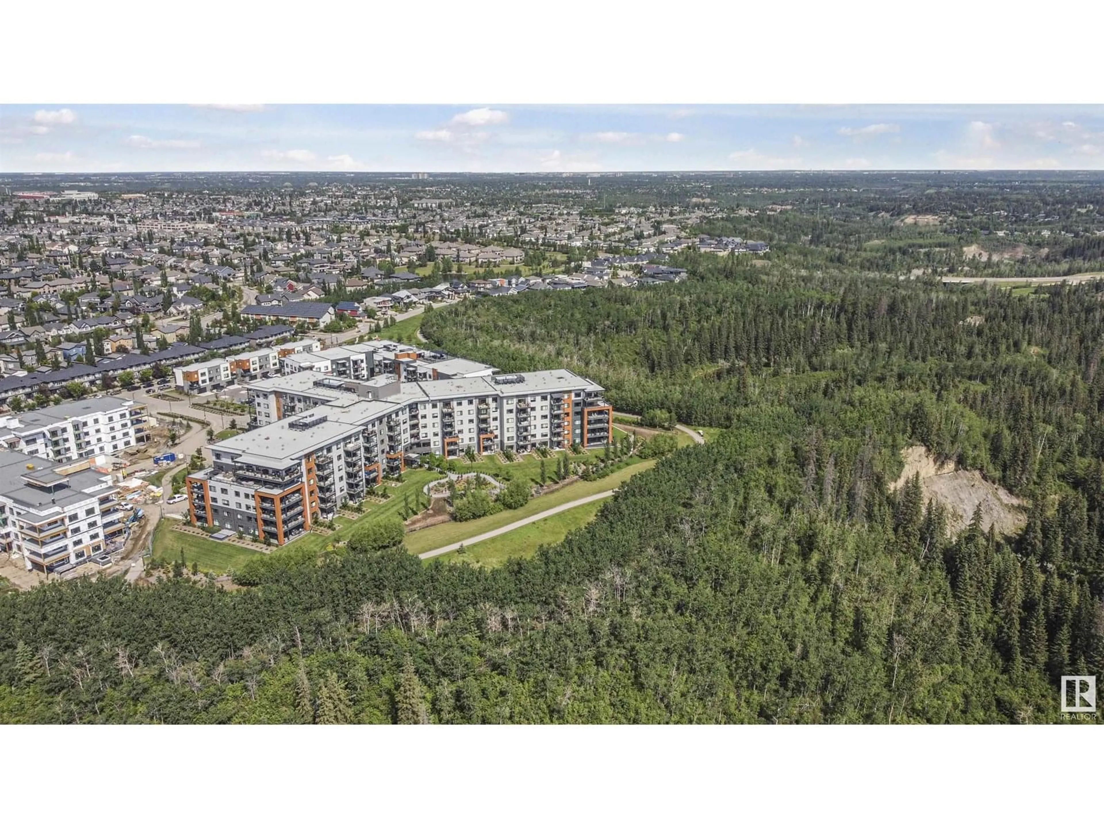 A pic from outside/outdoor area/front of a property/back of a property/a pic from drone, forest/trees view for 415 - 7463 MAY CM, Edmonton Alberta T6R0X1