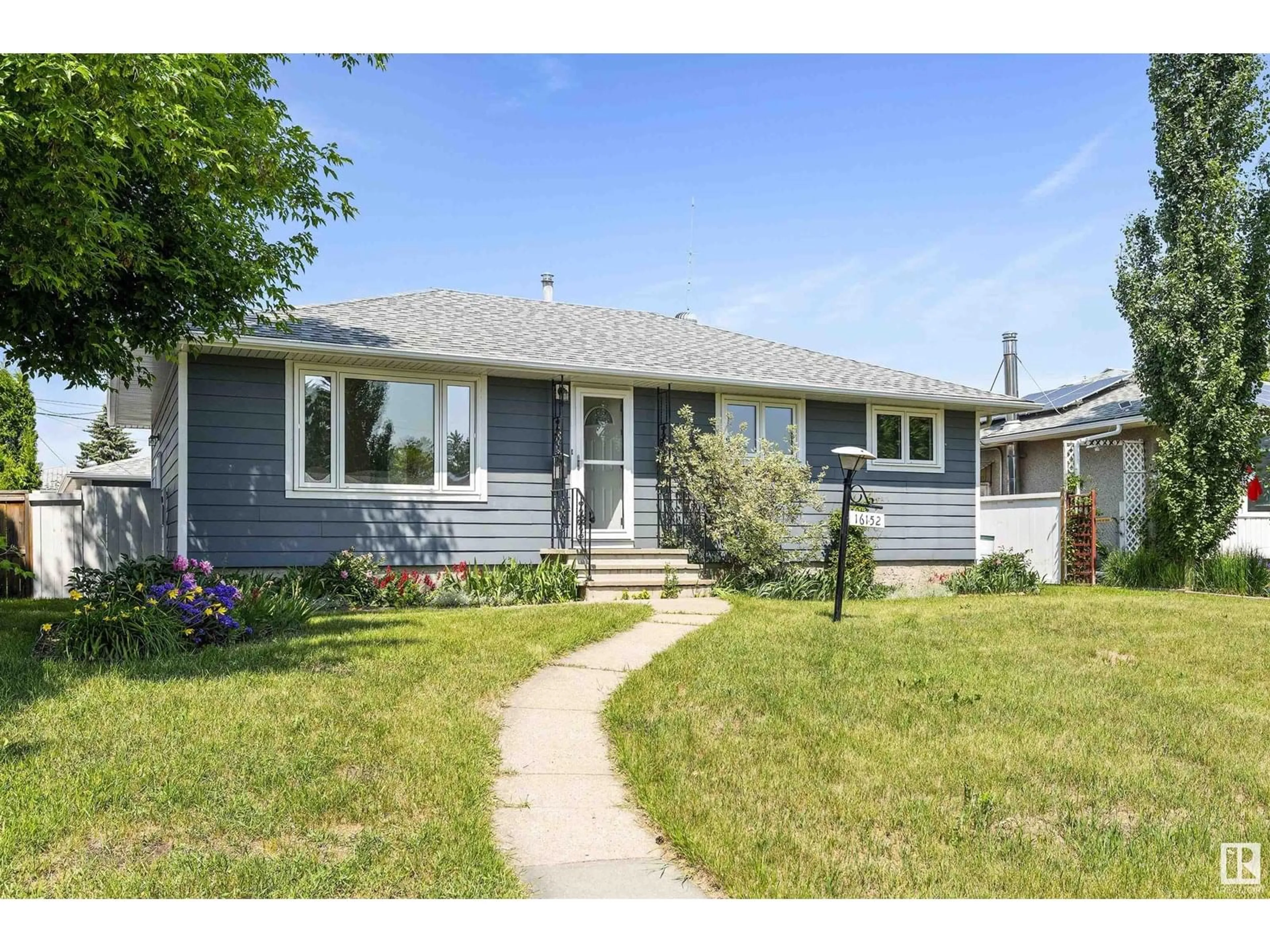 Home with vinyl exterior material, street for 16152 110A AV, Edmonton Alberta T5P1J1
